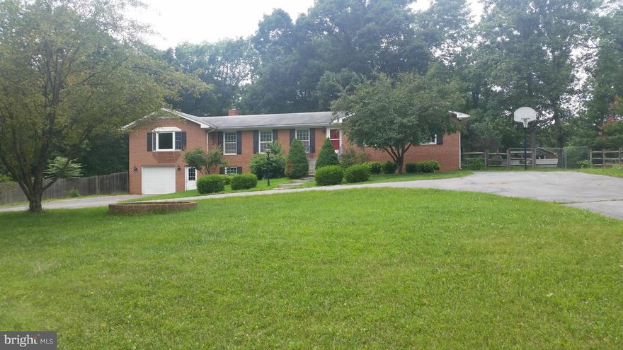 Spacious brick ranch on over 2 acres in highly desirable location. Country setting only minutes from town. Possible 4 bdrms on main floor with 2 full baths, library, updated kitchen, din. rm & large living area. Potential for another lg mstr bath & WIC. Washer & Dryer hook up on main floor & bsmt. Bsmt fully finished w/living area,kitchen & bath, bdrm, den & storage. Perfect for mother-inlaw suite