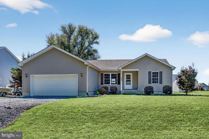 9/103 Well Maintained home ready for occupancy now....no waiting. Rancher, 3BR 2 BA featuring engineered hardwoods throughout, Split floor plan (master on one side other two bedrooms on opposite side), SS Appliances, kitchen bar, separate laundry area, front porch, rear deck, 20x23 ft garage. Captains Cove Golf & Waterfront Community amenities offer: 9 Hole Pristine Golf Course, 3 Pools (2 Outdoor/1 Indoor), Fitness Center, Boat Ramp, Basketball & Pickle-ball Courts, Playground, Picnic Area, Dog Park, Walking/Biking Trails, Security & more. Call for your private showing today!