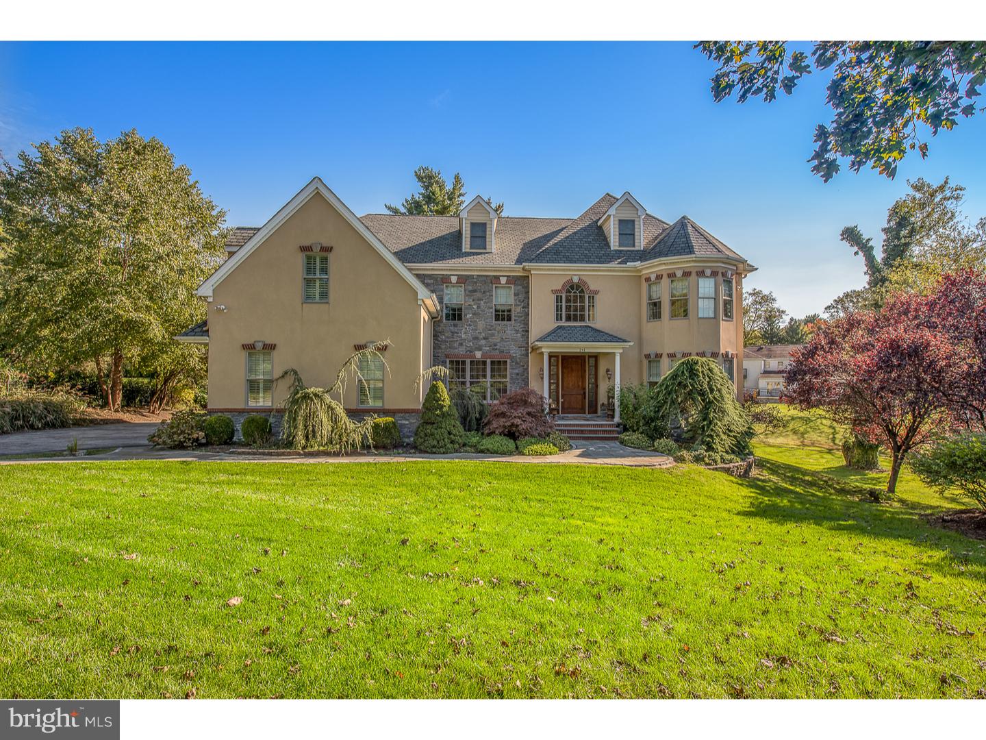 Situated on a premium street in the sought-after Penn Valley neighborhood, sits 241 Stacey Road with approximately 5,489 square feet of fabulous living space, picturesque curb appeal, lush gardens and a spacious deck. This home is the perfect balance of a stately traditional house with a contemporary open floor plan. No detail was spared in the design or construction of this custom-built home from Brazilian Tigerwood flooring to recessed panel wainscoting to the soaring ceilings to the high-end appliances ? 241 Stacey Road has it all! A grand staircase, a formal dining room to the left and the most elegant of living rooms to the right flank the magnificent 2-story foyer. The chef's kitchen is equipped with top of the line appliances, double ovens, granite counters, a center island with seating and a pantry fit for a king. The breakfast area which opens to the large back deck, a built in desk and wet bar with sink and wine refrigerator flow from the kitchen creating the perfect space to entertain. The family room includes a gas-burning fireplace, soaring ceilings and abundance of natural light from the large windows. An office with dark wood built in bookshelves, mudroom with direct access to the 3-car garage, plenty of closets and 2 powder rooms complete the first floor. The second floor includes a lavish master suite with a large sitting area, two large walk-in closets, and a spa-like bathroom with double vanity, a soaking tub and glass-enclosed shower. Four additional bedrooms with large closest, 2 with ensuite and two that share a Jack-n-Jill bathroom and, a laundry room with utility sink complete the second floor. The third floor has a recreational room, another bedroom, full bathroom, reading nook and extra storage. The unfinished lower level is the same footprint as the first floor. Some of this home's fabulous features include a beautifully landscaped yard, full house generator, oversized 3-car garage, mature landscaping, 4 zone heating/ac, numerous closest for storage and in the award winning Lower Merion School District. The property is walking distance to Penn Valley Elementary and Welsh Valley Middle School and conveniently located near major roadways, Center City & PHL Airport.