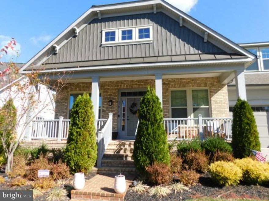 Potomac Shores Welcomes you to all its Beauty and Excellence in this Gorgeous 3 level home! Shows like a model home! This 4 Bedroom home boasts  Main level living and a view of the 13th Green and it boasts all the high-end finishes. Large Master Suite with fully adorned Master on-suite.  Gourmet Kitchen with a Huge island and still space for table dining.  The kitchen walks out to a screened-in patio to enjoy the view!  The upper-level bedroom is a suite as it offers a full bath and a living area that overlooks the main living.  Elementary thru High School is near by and easy to access.