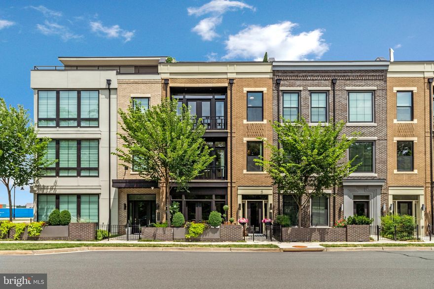 Five-Star Living Meets World-Class Design

The aura of Miami and LA meets the style of Paris and Milan in this 4,200 plus square foot designer-curated 4 level townhome in the heart of One Loudoun. With 4 bedrooms, 3 full baths, 2 half baths, a private Savaria elevator, and a rooftop retreat, this residence is built for the spotlight and designed for total ease. It blends global sophistication with championship level comfort and refined luxury.

Enter through the first floor into a garden café and reception lounge that channels the ambiance of an exclusive boutique hotel. Wrapped in lush landscaping and elevated with sophisticated finishes this signature arrival experience sets the tone refined, relaxed and designed to captivate. It is the kind of welcome typically reserved for luxury guests now part of your everyday life.

Inside, soaring ceilings and wide plank hardwoods create an expansive, gallery-like feel, elevated by Restoration Hardware lighting, Phillip Jeffries designer wallpaper, custom shades, and a full Sight and Sound system that delivers immersive audio throughout.

The open concept kitchen is a performance driven showpiece featuring Wolf and Sub-Zero appliances, full marble backsplash, Sri Goldberg designer lighting, and professional grade cabinetry systems. Just off the kitchen, a private terrace extends your culinary space outdoors, perfect for creating Michelin star inspired meals in an intimate setting. Whether you're meal prepping like a pro or entertaining the whole team, this kitchen delivers.

A balcony off the main living area brings in natural light and provides a seamless indoor-outdoor flow, adding even more hotel-style luxury to your everyday experience.

The private Savaria elevator provides seamless access to all four levels, leading to a primary suite designed for total relaxation and recovery. This personal retreat features remote controlled blackout curtains, a custom California Closet system, heated floors, dual vanities, and a spa-inspired wet room that brings the serenity of a five-star resort into everyday life. A private balcony just off the bedroom offers a quiet open-air escape perfect for morning coffee or unwinding at night.

The second level also features two additional generously sized bedrooms and a full bath, ideal for family, guests, or a home gym setup.

The top level is your private penthouse experience. A spacious loft opens onto a rooftop lounge with wet bar, wine fridge, gas grill hookup, and motorized awning, your all season entertaining space under the stars. Just beyond, a fourth bedroom with its own ensuite bath becomes a VIP suite for overnight guests or the ultimate private retreat.

Additional highlights include:
2 car garage with EV charger and sealed floors,
Custom California Closets throughout,
Control4 smart home automation,
ADT security system, and
Brand new washer and dryer installed in 2025.

Access to One Loudoun amenities including clubhouse, resort style pool, toddler pool, tennis courts, and multi use courts

Located across from Central Park and steps from world class dining, shopping, and nightlife, this fashion-forward luxury townhome offers privacy, presence, and performance all in one.

Global style.  Game day energy.  Everyday luxury.  This is your ultimate home field advantage.