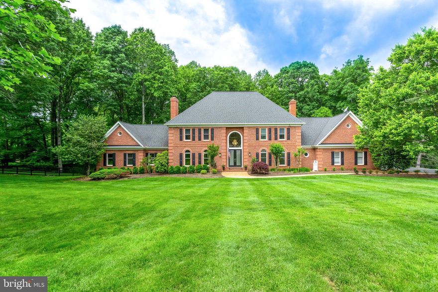 This stately one of a kind find features  HANDICAP ACCESSIBILITY  throughout the main level with a spacious  suite including a sitting room and a brand new (handicap equipped) spa bath!This Custom Contemporary Colonial offers 6 beds/5.5 baths of expansive moldings,built-ins, hardwoods, Embassy sized rooms, A BRAND-NEW Gourmet kitchen, a luxurious master suite with custom closets and spa bath,  4 sides Brick with a 3 car garage and a spacious mud room and Designer window coverings throughout.   A spacious walk-out lower level with over 2000 sq.ft that is complete with high end features to include a fitness center w/ sauna,hobby room, large recreation media room with surround sound, wet bar, whole house generator, surround sound SONOS system and wine cellar!Beautifully sited on a very private  cul-de-sac overlooking 2+ acres of manicured gardens and ornamental trees! Privacy abounds.... This home is truly unique on every level! You do not want to miss this amazing home on an amazing lot! OPEN HOUSE  JAN 19th 2-4