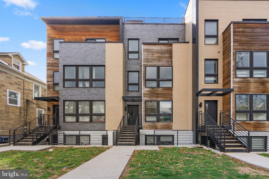 Welcome to this thoroughly modern townhome-style condo in the sought-after Brooks Row Condominiums of Brookland! Built in 2017, with 3 bedrooms and three full baths, here you will enjoy contemporary living across three thoughtfully designed levels, complete with a private rooftop terrace and assigned parking! The main level has an open-concept living room and dining room layout with floor-to-ceiling windows flooding the space with loads of natural light. The kitchen is equipped with stainless steel appliances, quartz countertops, custom cabinetry, a spacious pantry, and an oversized island for easy meal prep and entertaining. Off the kitchen, a versatile bedroom with an adjacent full bath is ideal as a guest suite, home office, or gym. One level up, the primary suite offers stunning city views and a spa-like ensuite bathroom with a double vanity and large closet. Next is another bedroom with a private balcony and a hall bath with an oversized shower and dual vanities, and a convenient laundry area complete this level. The enviable terrace is a rooftop retreat offering breathtaking views of the Washington Monument, Basilica, and DC skyline where you can enjoy al fresco dining and entertaining or just winding down at the end of the day. Located in the heart of Brookland, this home puts you just minutes from local shopping and dining favorites like Menomale, Primrose, Brookland's Finest, breweries, the Alamo Drafthouse, Union Market, the new Trader Joe’s opening soon and more. Commuters will love being close to the Brookland-CUA and Rhode Island Avenue Metro stations, major commuter routes, and the Metropolitan Branch Trail to Union Station while nearby parks, playgrounds, and dog parks broaden the neighborhood appeal, welcome home!  Qualified purchasers can this home using the Home Purchase Assistance Program (HPAP) helps first-time homebuyers in Washington by providing interest-free loans for down payments and closing costs. 
 Call the listing agent for more information!