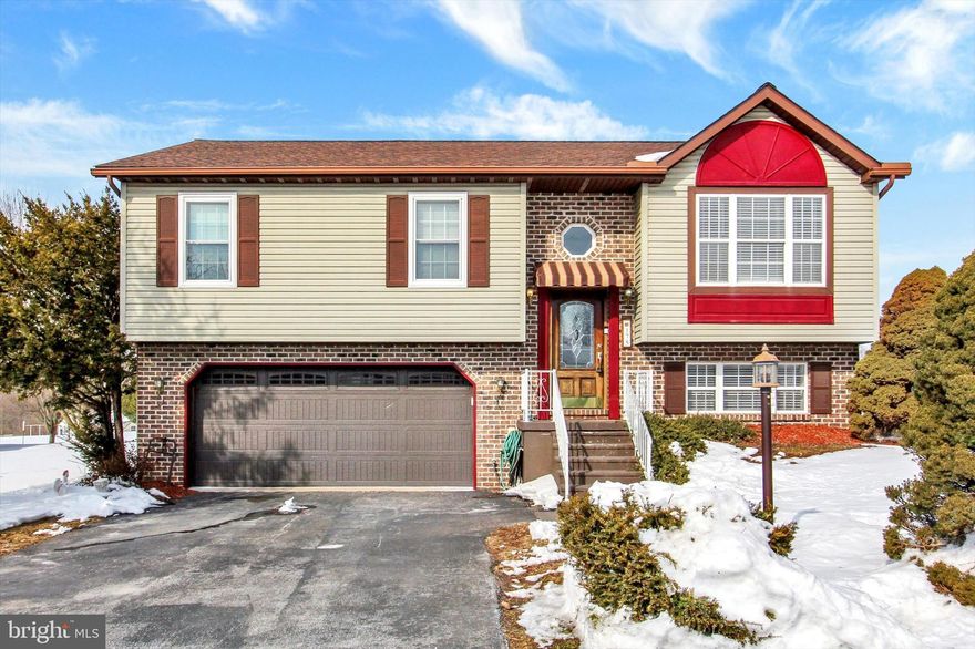 Nestled in the charming South Branch subdivision in Conewago Valley School District, this recently remodeled split foyer home with brand new (2025) roof, all new carpet installed days before listing house, 5 year old natural gas HVAC system, 5 year old gas water heater and 3 year old insulated garage door offers a perfect blend of comfort and functionality. With 2350 sqft of well-designed living space, this residence features two bedrooms (with possible 3rd bedroom in lower level). Primary bedroom has  crown molding and a private onsuite bath with walk-in shower.   The exceptionally nice  kitchen is equipped with stainless steel appliances, including a dishwasher, built-in microwave,  5 burner stove, refrigerator (new 2025), 69 lineal feet of granite countertop and 2 pantry cabinets.  Upgraded cabinets are dovetailed and soft close.  Washer and dryer also included. Lower level family room/possible 3rd bedroom boasts a cozy gas fireplace. Step outside to the expansive 3 year old deck, perfect for entertaining or simply soaking in the serene surroundings of the 0.33-acre lot fenced with 250 lineal feet of aluminum fencing with a 3 ft, a 5 ft and a 10 ft gate. The insulated windows ensure a comfortable environment year-round, while the attached front-entry garage provides easy access and additional storage. This well-maintained property, built in 1996 has exceptional curb appeal and is located very close to all the New Oxford Square and all the local amenities.