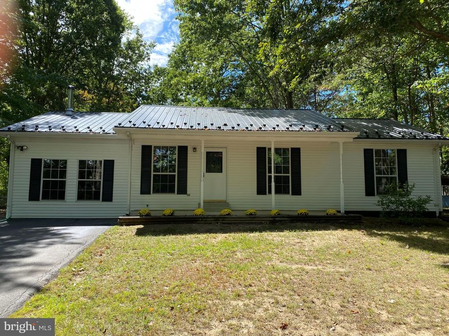 Newly updated, well maintained three-bedroom rambler on cul-de-sac with only one other home. Entire interior has been freshly painted. New Granite counters in Kitchen.  Family room with new carpet,  cozy wood burning stove and two ceiling  fans. New LVP flooring in Kitchen, Bathroom, Laundry Room and side door entry way. Refinished Hardwood flooring in Dining Room, Hallway and Main Bedroom. Other Two bedrooms have new carpet.  Main bedroom, second bedroom,  kitchen and dining room have ceiling fans as well. Large, fenced back yard with shed and deck. Metal roof installed in 2020.  Convenient to Exelon Power Plant, Cove Point and Pax.