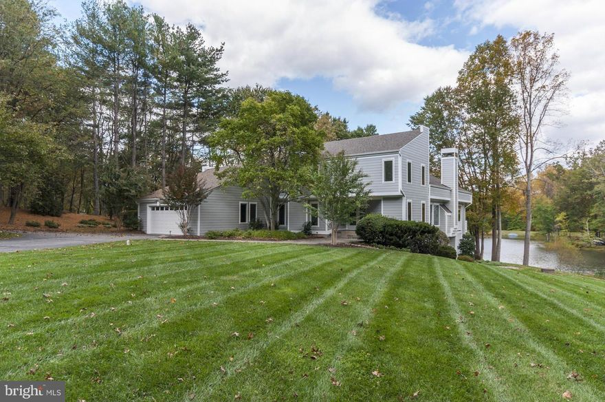 Beautiful sun-bathed lakefront property in the much sought after Lake Windermere community. Breathtaking views from this Contemporary that sits on almost 2 private acres. Offering updated eat-in gourmet kitchen, large family room, expansive master suite w/ updated bath, an additional 4 BR & 3.5 BA, 2 fireplaces, office, 3 decks with water views, walk out lower level, generator & 2-car garage.