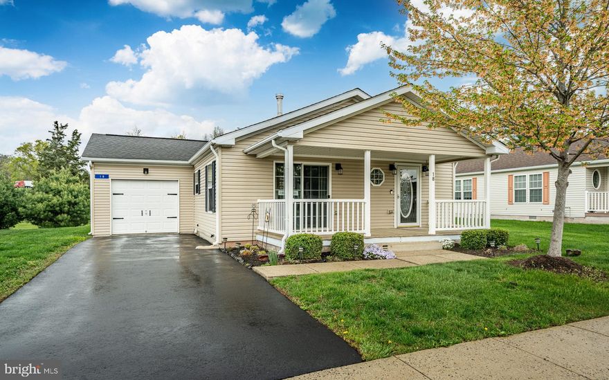 Immaculate home with attached garage on a premium lot in the desirable Douglass Village 55+ community. This home has fresh paint and carpets and newer appliances too. The location offers a bit more privacy within the community. A welcoming front porch is the place to be this time of year. Inside you'll find an open floor plan and ample kitchen. A gas fireplace accents the large living area. The laundry area is conveniently located off the garage. A huge walk in closet and en-suite bath in the primary bedroom offer everything you need. There are two more bedrooms and a hall bath too. The vibrant Douglass Village community features a club house with a beautiful outdoor pool, a gym, game room for poker nights an activity room for yoga and more, plus friendly on-site management and maintenance. No more grass cutting or sidewalk shoveling.
This super convenient location has great access to major routes, shopping, natural areas and golf.