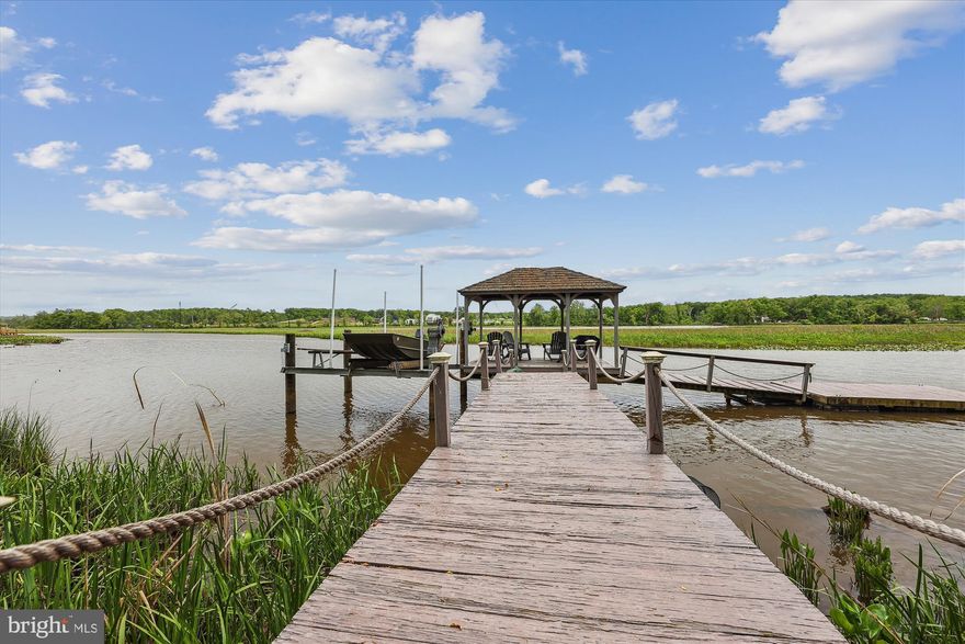 Buyers financing fell apart pending release. Your 2nd chance, Appraised for 1.4M. Welcome to this stunning 5 bedroom, 4.5 bathroom waterfront home Situated on a large private lot, this home is perfect for entertaining with a large private yard with direct access to the waterfront and a private dock. This waterfront property sits on 1.85 acres lot.

As you enter the home, you will immediately be impressed by the open kitchen with gas stove in the island, and the living room with its high ceilings and gas fireplace. One bedroom with ensuite bathroom on main level for guests or In-laws. On the upper level you will find 4 bedrooms, including the master bedroom with its own bathroom. The other two bedrooms share a jack and jill bathroom.

The home sits next to the community lot which has a boat ramp, you can park your canoes and kayaks there, you can enjoy firepits and water views there, even the tot lot for the kids! The house it also situated next to a NATIONAL PARK for those hikers and nature lovers. There is an HOA that is OPTIONAL at 40/year for access to the lock on this community park.  This home has the only covered dock on the creek! You cannot cover your dock anymore - grandfathered in. Geothermal furnace highly efficient and money saving system!

This is an amazing opportunity to own a beautiful waterfront property and generate a great income. Don't wait and contact us now to schedule a private tour! Seller has set deadline to register offers by 3 pm on Tuesday decision will be made after 8 pm on Tuesday.