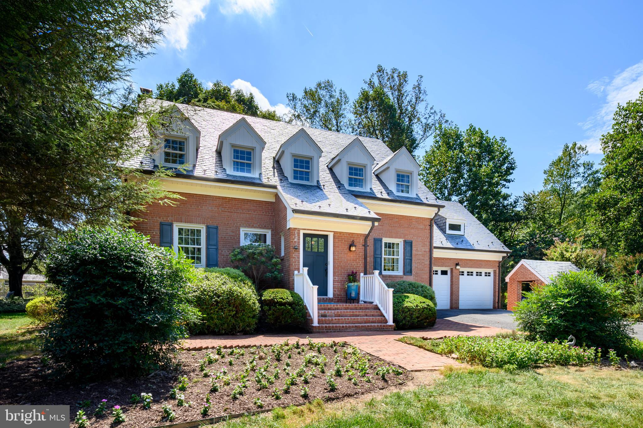 Outstanding single family home in a prime location offering versatile living spaces and sited on a beautifully landscaped lot adorned with lush gardens. This all-brick home features a slate roof, plaster walls and solid wood doors throughout exuding classic craftsmanship and enduring beauty. The vestibule provides a transition space and a moment of pause between the outdoor tranquility and indoor charm. Rich hardwood flooring and 9' ceiling on the main level blend warmth and openness. The eat-in kitchen offers cherry cabinetry, Silestone countertops and a spacious breakfast area. Relax in the living room with a wood burning fireplace and entertain in the formal dining room with crown molding and chair rail. The den/office could function as a main level bedroom with easy access to a main level full bath. Upstairs you will find four spacious bedrooms and two full bathrooms. All four bedroom and the hallway feature hardwood flooring or hardwood under carpet. Don't miss the large cedar closet, pull down attic access for extra storage and the laundry chute. The lower level offers more great spaces including a relaxing family room, a hobby room with exposed cherry beams and custom wood paneling, a large laundry area, a renovated full bath and a workshop/utility room. The back yard features a brick patio and is perfect for a gardening enthusiast with a 50' x 40' fenced garden area and a 20 x 12 shed. A brick shed and two car garage offer additional exterior storage. This exceptional home is located on a no thru street in Fulton yet offers easy access to commuter routes and all modern conveniences in Maple Lawn.