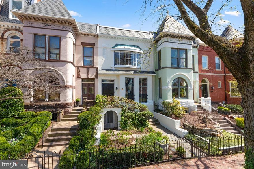 This attractive Georgetown Victorian row home has been restored and modernized by the current owners to offer exceptional living and entertaining space. The main level provides high ceilings, original woodwork, an open living/dining room and an open kitchen/family room. The family room's wood-burning fireplace is flanked by glass doors leading to a delightful, private garden. The kitchen, with granite counters, and an island offers fantastic workspace, cabinet space, and a cozy breakfast area. The upper level, which originally had 4 bedrooms, has been transformed into a large owner's suite with walk-in closet/dressing room, and spacious bath with separate shower and jetted tub. The front bedroom has a large bay window overlooking the playing fields at park-like Georgetown Visitation school. The lower level has two outside entrances has previously been used as a family room/guest room with a full bath and a laundry/utility room.  A most unique feature of the home, especially for Georgetown, is the detached 2-level carriage house with 2-car garage. It is easy to envision the possibilities.