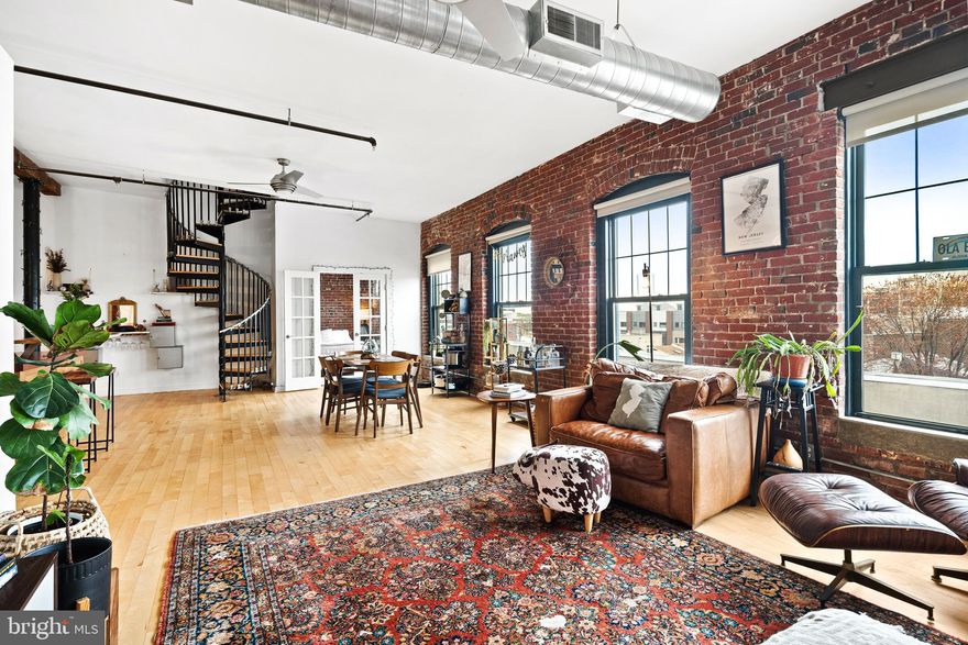Stunning Factory Loft Conversion in Prime Fishtown – Parking & Roof Deck!

Welcome to 1125 E Columbia Ave #302, a breathtaking 2-bedroom, 1 and a half bathroom loft in the heart of Fishtown, offering an unparalleled blend of industrial charm and modern convenience. This semi bi-level residence boasts 14’ ceilings, exposed brick, and exposed beams, creating a picturesque and spacious atmosphere.

Located in a sought-after factory loft conversion, this home features central air, an open floor plan, and oversized windows that flood the space with natural light. Enjoy gated parking and access to a roof deck with stunning city views.

Perfectly positioned near Penn Treaty Park, Frankford Ave’s top restaurants and shops, and I-95 for easy commuting, this loft offers the ultimate urban lifestyle in one of Philadelphia’s most vibrant neighborhoods.

Don’t miss this rare opportunity—schedule your showing today!