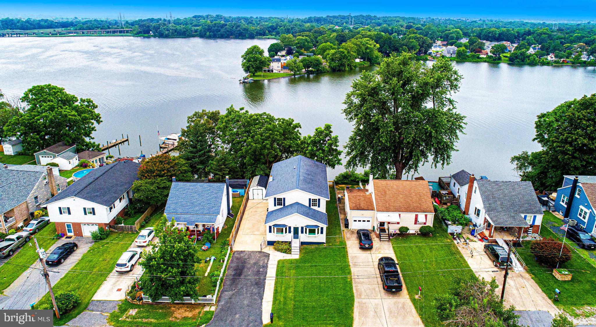 Welcome to this fully renovated waterfront gem offering a seamless blend of modern luxury and serene water views. Conveniently located minutes to downtown Baltimore and an hour to Washington DC, this spacious five-bedroom, four-full-bathroom home boasts over 2,265+ square feet of finished above-grade living space and an additional 400+ square feet in the fully finished basement.
Step outside to your brand-new, massive deck designed for entertaining and relaxing while soaking in the breathtaking water views. Take a few steps down to a private platform, perfect for launching kayaks and paddleboards. While the property does not currently have a pier, one can be added for easy boat access. Trailer your boat in your oversized driveway while the pier is being built!
Renovated to Perfection: Every inch of this home has been thoughtfully renovated, featuring new low-voltage LED lighting throughout, 22mil Herringbone Luxury Vinyl Plank floors, and Moen plumbing fixtures for added durability and style. Custom stair treads and modern six-panel doors with Kwikset Microban handles elevate the home’s aesthetics and functionality.
Gourmet Kitchen: Enjoy a chef-inspired kitchen with Quartz countertops and LG fingerprint-proof stainless steel appliances, including a gas stove and microwave with a ducted exhaust. The designer tile backsplash and bathroom tiles are grouted with single-component stain-proof grout, ensuring you never have to worry about sealing again. You'll love the dimmable waterproof LED under-cabinet lighting for a truly modern touch.
Bathrooms: The home’s four bathrooms are fully updated with all-new toilets, tubs, vanities, LED mirrors with a timed defrost function, and bathroom exhaust fans.
Modern Conveniences: The second floor is equipped with its own, dedicated HVAC unit for perfect climate control, and a stacked washer and dryer for added convenience. The 200-amp electrical panel is brand new, alongside all new Decora switches and receptacles, making this home future-proof. A brand new 50 gallon water heater was just installed and everything was just wired for ethernet/telephone .
Erosion Control: The back hill has been reinforced with a 4" Geocell erosion control solution to ensure the property stays beautiful for years to come. Creeping Juniper and Native Wildflowers have been planted on the hill also.
This home offers the best of both worlds—an idyllic waterfront setting with state-of-the-art modern upgrades. Whether you're looking to entertain, relax, or enjoy outdoor adventures, this house checks all the boxes. Don’t miss your chance to own this stunning freshly renovated property—schedule a showing today!