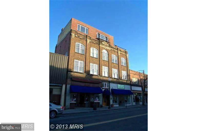 The building comprises eight residential (two bed / 1 bath) units and two commercial spaces. There is also a penthouse unit that was framed out many years ago and a one bedroom efficiency that can be completed if desired. Additionally, there is a two car garage in the back and a tremendous amount of storage capability in the basement and in an area that connects the garage to the building.