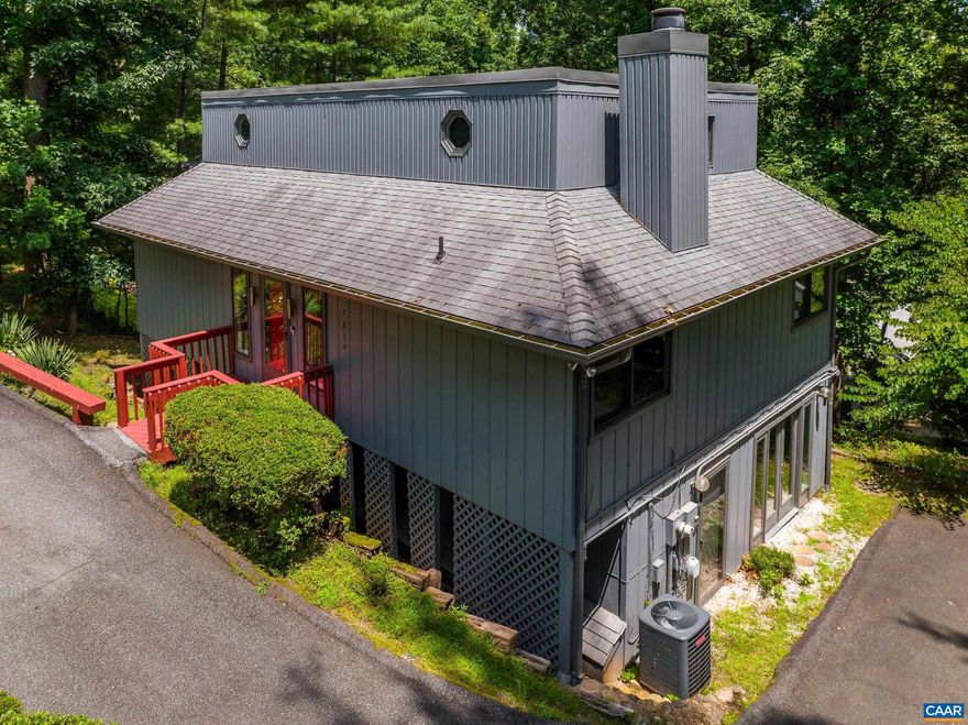 Great value!  Great vibe in this mid century modern style home! Rare opportunity to own a unique, custom home in desirable Greenbrier area. So many updates but still opportunities to customize and make it yours. Fantastic location minutes to downtown and 29. Walkable to schools, parks and the Rivanna Trail. Great floor plan with bedrooms and full baths on each floor!  You'll love the freshly painted interior with LVT floors in the common areas. The main level of the home features an updated kitchen with maple cabinets, and tile counters, large living room with vintage gas fireplace, and a large dining area. Enjoy the wall of sliding doors overlooking the expansive deck in the trees! Two bedrooms on the main level share a fully remodeled bathroom with easy-entry tiled shower stall. Upstairs the large primary suite features exposed beams, a private bathroom and large closet area. The laundry/utility room is also located upstairs for ease. The lower level features a fourth bedroom, full bathroom, large rec room and mini kitchen - with a separate entrance this could be an apartment. Plenty of storage on the lower level too!,Maple Cabinets,Tile Counter,Fireplace in Living Room