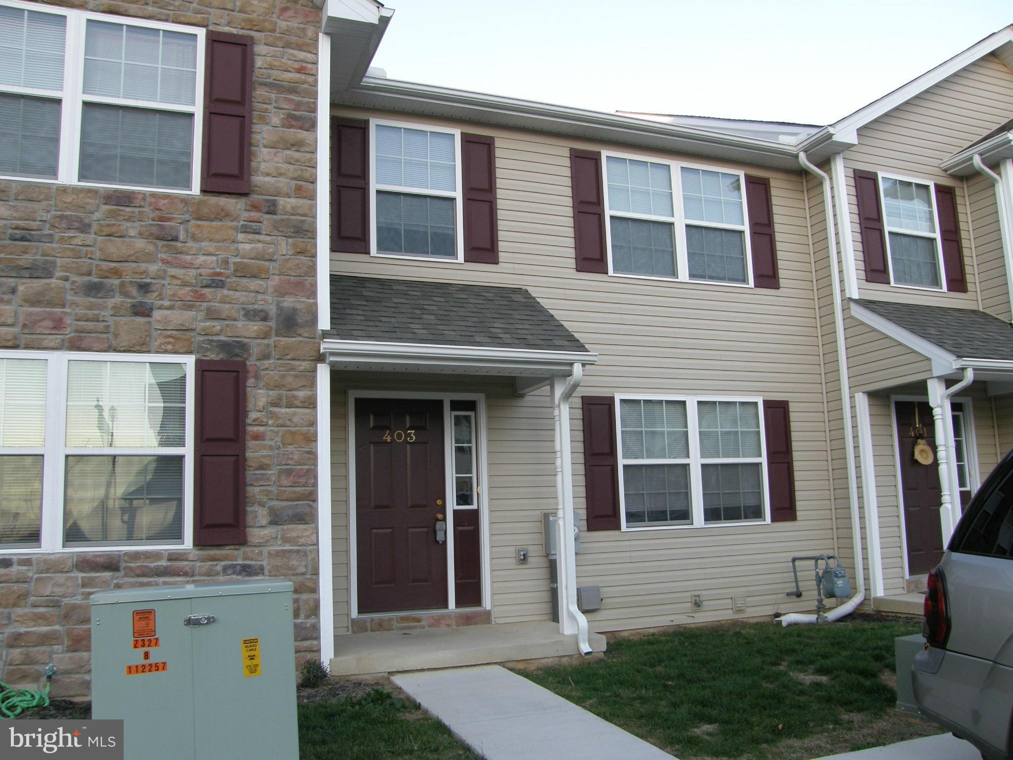 Spacious townhouse styled condominium in Grandview Estates offers a covered front porch, nice size living room, half bath, dining area open to equipped kitchen w/pantry & sliding glass door to deck. MBR with attached bath, 2 bedrooms & full bath upstairs. Lower level has laundry room & 1-car garage - w/two off street parking spaces. Great views & MORE! *Photos of similar unit