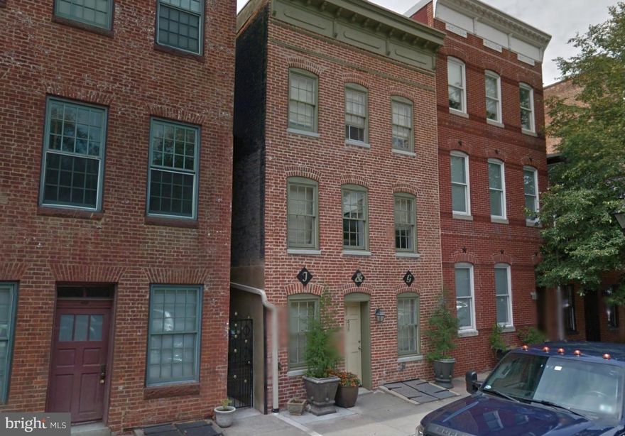 AWESOME opportunity to get a fantastic, completely rebuilt (2011) building from the ground up that offers a beautiful gourmet kitchen with granite counter tops and stainless steel appliances, hardwood floors, full size washer/dryer, rear bricked patio for grilling and relaxing that is less than a block from the parking garage and water front in Historic Fells Point!