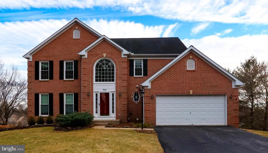 Open House Sunday Feb 8th 11 AM to 1 PM. 5 Bedroom 3.5 Bathroom Colonial with Basement In-Law Suite and 2 Car Oversized Garage.The Main Level Features a Foyer with a 17 Foot High Cathedral Ceiling with Wood Floors, Powder Room, and Coat Closet, Living Room with Bay Window, Crown Molding, and Carpet, Formal Dining Room with Chandelier, Crown Molding, Chair Molding, and Carpet, Gourmet Kitchen with Island, Pantry, Granite Countertops, Stainless Steel Appliances, Ceramic Tile Floor, Recessed Lighting, Built in Desk, Double Stainless Steel Sink, Dishwasher,  Under Cabinet Mount Microwave, Sunroom with Ample Natural Light, Eating Area, Skylights, Recessed Lighting, Ceramic Floors, and Walkout to 20' x 14' Wood Deck, Family Room with Wood Burning Brick Fireplace, Ceiling Fan, Recessed Lighting and Carpet, Laundry Area/Potential Mudroom with Laundry Hook Up, Ceramic Flooring, Shelving, and Recessed Lighting, and 21' x 20' Two Car Garage with Shelving and Built-in Storage. The Upper Level Features a Primary Bedroom with Sitting Area, French Doors, Ceiling Fan, Recessed Lighting, and Walk-In Closet, Primary Bathroom with Separate Sink Vanities, Lighted Mirrors with Defog Option, Jacuzzi Tub, Stall Shower, Recessed Lighting , and Ceramic Floors, Bedrooms 2, 3, and 4 all feature Double Door Closets, Recessed Lighting, and Carpet, Hallway Bathroom with Skylight, Double Sink, Recessed Lighting, Tub Shower and Ceramic Tile Floor, and Hallway Closet with Shelving. The Basement was Converted to an In-Law Suite in 2005 with Ample Double Door Closet Space for Storage and Clothes, Carpet, Recessed Lighting. It Features Bedroom 5 with Ceiling Fans, Carpet, Rear Walkout to Patio 15' x 14', Kitchen with Stainless Steel Double Sink, Refrigerator, Electric Stove, and Undermount Microwave, Recessed Lighting, Space for Table, and Ceramic Floor, Workshop and Storage Area with Work Table and Shelving, Laundry Room with Washer and Dryer, Laundry Basin, and Ceramic Tile Floor, and Full Bathroom with Tub Shower, Ceramic Tile, and Linen Closet. The Basement Would Also be Perfect as a Recreation / Entertainment Space. Exterior Highlights include Two Story Brick Front, Double Pane Windows, Palladian Window Above the Front Entrance, and Fire Pit in Rear Yard. Updates include Fresh Paint and Carpet on the Main and Upper Levels, Recessed Lighting, and New Water Heater (2026), Windows (2024), New Roof (2018), and In-Law Suite (2005). Appliances are Sold As Is. Please Click the Video Icon to View an Interactive Virtual Tour of the Interior of the Property. Floor Plan in Disclosures.