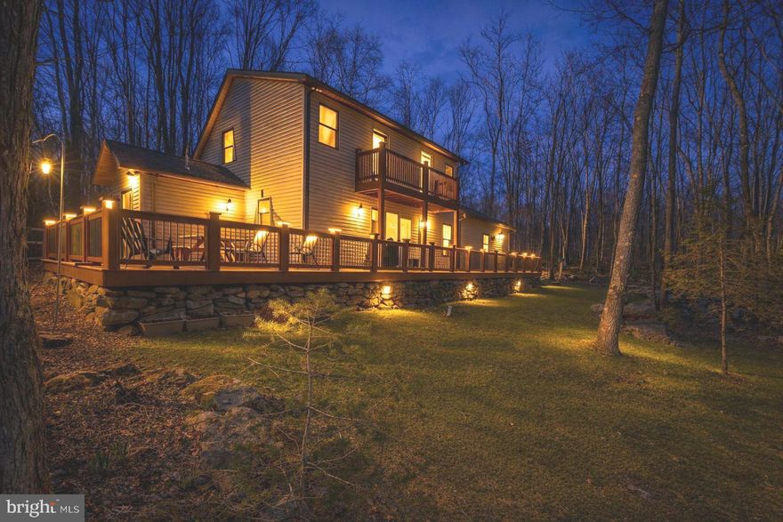 Designed and built for the sellers, this 4 bedroom, 2.5 bath home is a true showcase of craftsmanship featuring handmade woodwork crafted from trees sourced directly from the property.  Many specialty items will remain, including bathroom vanities, multiple dressers, a primary suite custom TV console, a built-in bunk bed, and more.  The spacious primary suite was added in 2016 and offers a separate living area, cozy gas fireplace, and beautiful hardwood floors.  The open floor plan on the main living level with kitchen and dining areas is perfect for family gatherings and entertaining guests.  The entry-level laundry with dog wash, a screened porch, and separate office space check all the boxes for your "wish list".
Enjoy your outside space with a little over 3 acres, complete with a firepit area and walking trails throughout the property.  Two detached garages, one oversized and both finished, are insulated for cars, additional storage, or hobby workshop. The A-frame cottage for kids is perfect for the ultimate in playtime
Make an appointment today to tour this one-of-a-kind home in this beautiful "park-like" setting! Special Financing Options Available.