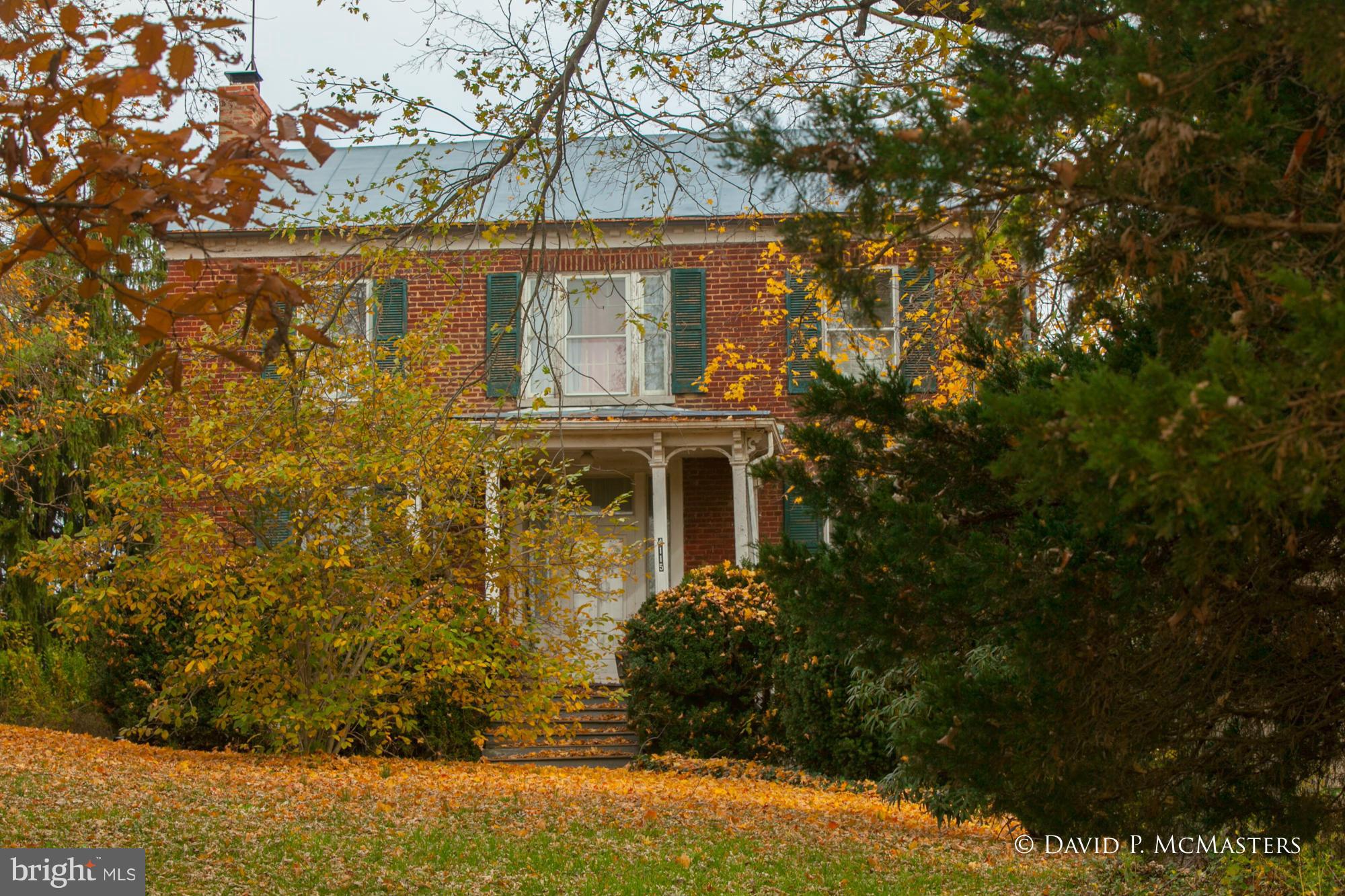 3-4 BR gracious ca.1811 brick colonial home 7 acres in JeffCo Primary Growth area. Barn + 2 BR guest house 500' road frontage . Across fr Comfort Suites, Coast Guard/IRS facilities,Sheetz close to VA Hospital. RE-ZONED Residental-light industrial-commercial!. Another 16 adj acres avail...40x80 steel building on west side included. Rents can cover mortgage. Great investment! PRICE REDUCTION.