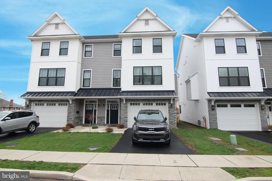 Available for rent May 1st is this just five year old, beautifully maintained twin home located within the sought-after Upper Merion School District. Step inside to the versatile lower level featuring a spacious flex space, great for a home gym, office, or just extra living space! Upstairs, the main living area boasts an open floor plan with gleaming hardwood floors, a modern kitchen with stainless steel appliances, granite countertops, a center island with bar seating, and a bright dining area that flows seamlessly into the living room. A stylish powder room completes this level. On the top floor, the spacious primary bedroom offers a large walk-in closet and ensuite bathroom with a glass-enclosed stall shower and a double vanity. Two additional generously sized bedrooms share a full hallway bathroom with a tub/shower combo. The laundry area is conveniently tucked away in a hallway closet. Enjoy premium outdoor living with a back deck off the kitchen—perfect for summer BBQs and entertaining. Parking is easy with a one-car attached garage plus an additional driveway space. The home also offers the benefits of a water softener! Located close to public transportation and major routes including 202, 422, 476, and the PA Turnpike.