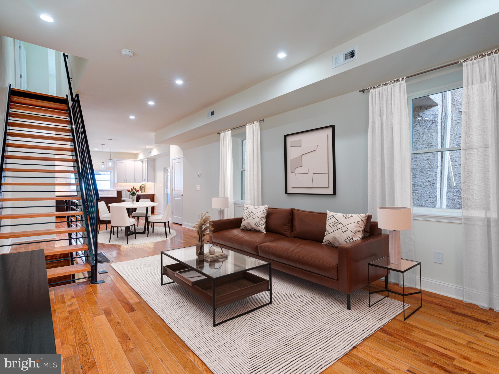 There is a Tax Abatement on the improvements done for his home on one of the best blocks in Fishtown. We are all about 2127 E Firth St, a beautifully renovated 3-bedroom, 2.5 bath, 3 story home nestled along the Frankford Arts corridor in Fishtown. This magnificent home boasts two outdoor spaces: a front porch with a raised garden bed and an enclosed large rear yard with plush grass and a side patio accessible through the kitchen and from the front of the home. The modern interior features Bruce hardwood floors and a spacious open-concept living and dining area, perfect for entertaining or relaxing. High ceiling with tons of windows provides tons of natural light expanding the open and spacious feel. The kitchen is equipped with new stainless steel appliances, quartz countertops, a center island with seating, and stylish 40 inch two-tone cabinetry. The second floor offers two spacious bedrooms, tons of closet space and a shared full bath with a laundry room. The third floor features an impressive suite with two walk-in closets, a linen closet, and a private bath with a soaking tub, twin oversized vanities, and a walk-in shower with a bench. The set up of the master suite is a must see with the extra space that could be a home-office or a nursery. This home truly combines classic materials and colors with modern amenities, including recessed lighting and new flooring throughout. Dual hvac, central air, 200 amp electric -- all mechanicals being new. Finished basement with waterproof flooring. From the new colonial red brick front to every detail, this renovation is both thoughtful and meticulous to the fullest extent. Not to mention a tax abatement included on the improvements. The 2100 block of E Firth is simply special with immaculate new construction on the block including the well known Parish homes across the street. Parking is also a breeze with Trenton Ave a half block away. If you're interested in learning more or scheduling a viewing, please don't hesitate to reach out as property is vacant and ready to show.