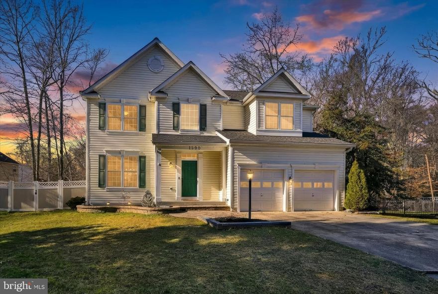 Exquisite custom-built Colonial in the highly desirable Chapman Farms community, located within the sought-after Crofton High School district. Set on a premium .42-acre lot backing to mature woods, this elegant residence welcomes you into a light-filled two-story foyer with gleaming hardwood floors throughout the main level. The formal living and dining rooms offer refined details with crown molding, chair rail trim, and dramatic floor-to-ceiling windows that bathe the space in natural sunlight. The updated kitchen features granite countertops, stainless steel appliances, and ample cabinetry—an ideal setting for the most discerning cooks—opening to generous living space perfect for both everyday comfort and entertaining. Adjacent to the kitchen, the spacious family room overlooks the kitchen and offers a warm and inviting gas fireplace for gatherings. The expansive primary bedroom boasts soaring cathedral ceilings, a cozy sitting area, and a private spa-like bathroom with separate shower and relaxing garden soaking tub; the newly completed contemporary owner’s bath (12/25) showcases lavish finishes and modern elegance. Three additional large bedrooms perfectly complete the upper level. The fully finished basement provides abundant flexible space for a recreation area, game room, gym, or media space, and includes a full bathroom and a 5th bedroom—ideal for guests or multi-generational living. Off the main level, a stunning four-seasons room stretches across the back of the home, perched over the large private lot and offering scenic wooded views year-round, perfect for relaxing mornings or evening entertaining. The lot features a serene wooded backdrop and a firepit installed in 2023—perfect for outdoor gatherings under the stars. This exceptional residence includes numerous major improvements: new roof and gutter guards (2023), updated lighting fixtures throughout (2023), sanitized air ducts and UV light installed on HVAC (2023), interior painting (12/25), new contemporary owner’s bathroom (12/25), and custom closet organizers added 2023–2024. Premium community amenities elevate the lifestyle even further: walking trails, a clubhouse for social events, tennis and pickleball courts, and a playground area, plus the convenience of walking distance to Walden’s pool. Conveniently located to major routes 3, 97, 32, 295, I-95, and 495, offering an easy commute to Washington DC/Northern VA, Baltimore City, Fort Meade Military Base, NSA headquarters, CIA headquarters, DISA, and US Cyber Command—ideal for both government and private-sector professionals.