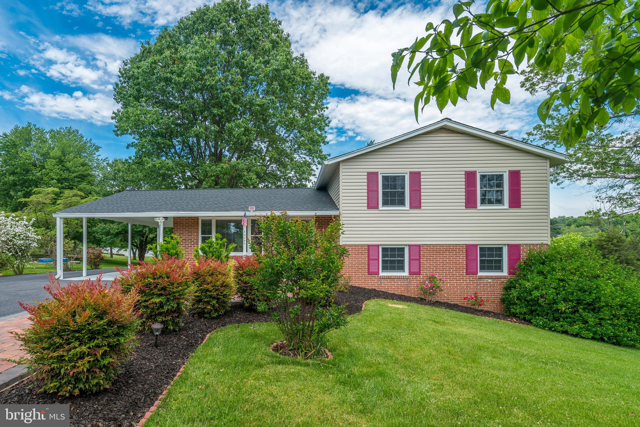 A COMPLETELY RENOVATED MOVE IN READY SINGLE FAMILY HOME on a peaceful 1/2 acre retreat with spectacular views. Welcome to this beautiful single-family home within 1 mile of the Clarksburg Town Center! Brand new roof with architectural shingles, new siding, beautiful professionally landscaped lot, with an oversized driveway, 4 bedrooms with an exceptionally spacious floor plan! The main level features hardwood floors and recessed lights throughout the open floor plan, living , kitchen, and breakfast area. Enjoy your gourmet kitchen with granite counters, stainless appliances, 42 inch high quality cabinets and beautiful back-splash. There is a step down to your 21x15 newly renovated family room with a wood burning fireplace, granite mantel, recess lights, recently renovated 4th bedroom with built-in book shelves, new 3rd bathroom, The windows, exterior doors, storm door, Trane HVAC system, hot water heater and windows have all been recently replaced! Delightful recently finished lower level rec room plus abundant storage with 4 large closets! Not to be overlooked is the fabulous lot with landscaping, mature trees and beautifully level! Located right on the Frederick/Montgomery county line and just 5 min from I-270 makes this location convenient to all that Frederick and Montgomery counties have to offer! Walking distance to Ovid Hazen Wells Park.