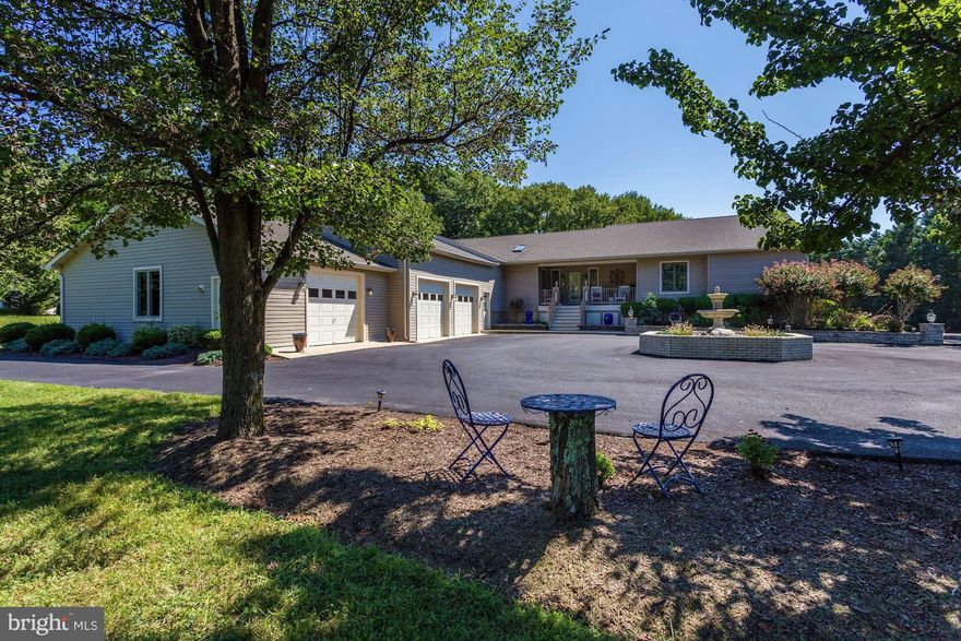 Stunning remodeled lakefront raised rancher on 3 acres! 5 bedroom 3.5 baths, 3 car garage, beautifully landscaped with pool and gazebo. Custom remodeled kitchen and master bath, custom built in shelving in the living room. Wrap around patio facing the lake and pool. Fully finished basement with full kitchen. Absolutely lovely home!