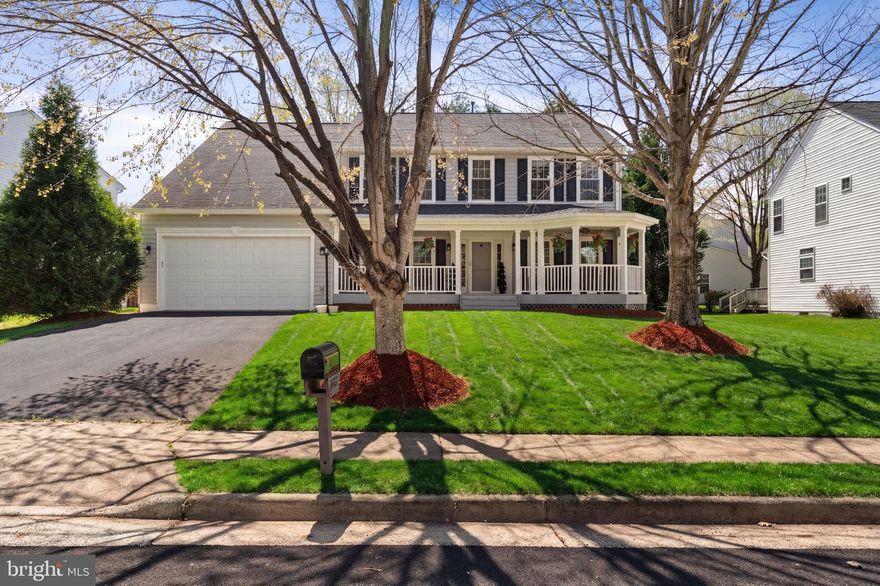 Welcome home to the sought-after Ashland community, centrally located in Manassas! This beautifully maintained 5-bedroom, 3.5 bath home offers over 4,000 square feet of finished living space across three levels. A charming front porch creates the perfect space to relax and sets a warm, inviting tone from the moment you arrive. As you step inside, you’ll be impressed by the bright two-story foyer and gleaming hardwood floors that flow throughout much of the main level. The spacious layout features a private office with French doors and built-in shelving, formal living and dining rooms with crown molding and chair rail, and a cozy family room with a wood-burning fireplace. The gourmet kitchen showcases granite countertops, a large center island, and opens to a vaulted breakfast room filled with natural light. The layout flows seamlessly to the screened-in porch and patio—perfect for relaxing or entertaining while enjoying the peaceful wooded backyard views. The upper level features a spacious primary suite with hardwood floors, a large walk-in closet, and a luxurious ensuite bath with dual vanities, soaking tub, frameless glass shower, and private water closet. Four additional bedrooms and a beautifully renovated hall bath complete the upper level. The finished lower level offers the perfect space for entertaining or everyday living with a large rec room, bonus flex room ideal for a gym or guest space, a renovated full bath, and ample storage. Major updates include HVAC and water heater (2025), windows and siding (2022), and a 50-year architectural roof (2019). Enjoy all that Ashland has to offer, including a community pool, tennis and pickleball courts, basketball courts, playgrounds, and walking paths. Conveniently located within close proximity to Ashland Elementary School, shopping, dining, and major commuter routes—this home truly has it all. Don’t miss it!