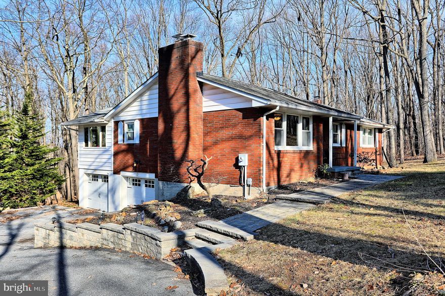 COMING SOON  Welcome to your wooded paradise! This  3 bedroom 3 full bath 2 car garage  partial brick rancher is nestled on .62  partially wooded acres in Westminster.. Beautiful open living room with hardwood floors, a large window and wood burning fireplace greet you when you open the front door.  The kitchen with granite countertops and stainless appliances was remodeled in 2017, the same year the windows in the main part of the home were replaced.  The family room is located just off the kitchen with wood vaulted ceilings and walls of windows which overlooks the beautiful woods and gives it a bit of a cabin feel. Doors from the family room lead to the large deck which has an automatic retractable awning for those sunny/rainy days. The master bedroom also has a door that leads to the deck. The master has wood floors, and  an updated master bathroom. Bedroom 2 and 3 are also located on the main level. Both are generously sized and have wood floors. There is a main level hall bath as well.  Venture down to the the lower level where you will find  built ins, a full bathroom and a wood stove that keeps the lower level very cozy. There is a door in the lower level that leads to the patio and the hot tub.  The laundry room is also located in the lower level. The 2 car garage is located outside the door from the laundry room. The  garage not only holds 2 cars but has a huge separate work space and an extra room with a door for storage. Garage doors were replaced in 2017 The Skylights in the home were replaced in 2016, HVAC was installed in April 2018. This home offers so much, it is a must see! Close to Routes 26, 27, 32, 140 and 97