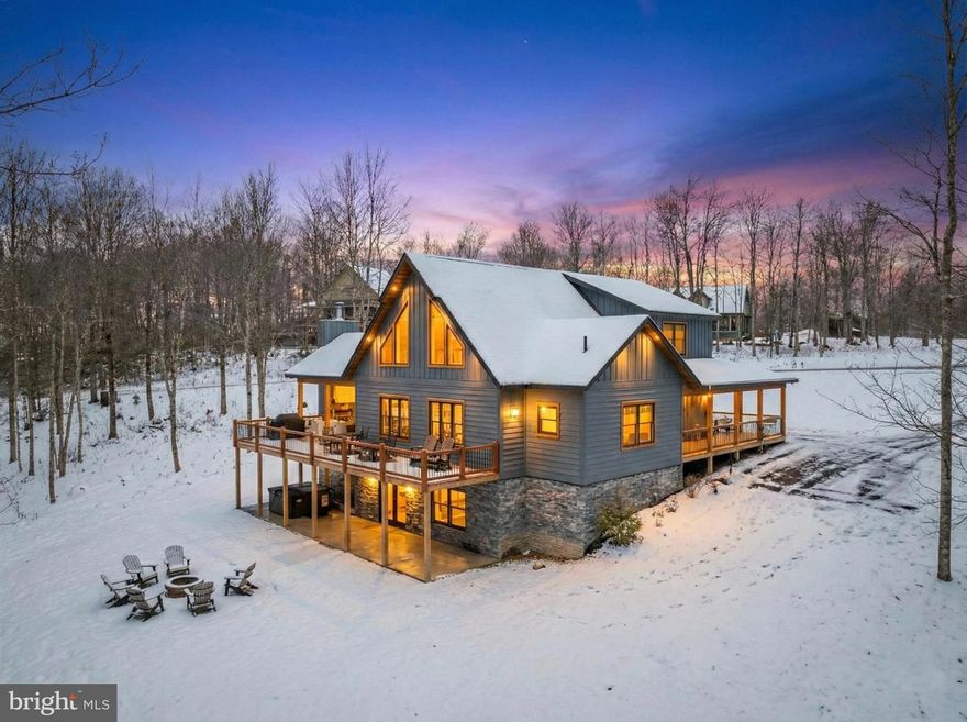 Discover mountain living in this stunning five-bedroom home near Lodestone Golf Course and Wisp Ski Resort. The home is warm and inviting from the moment you enter, offering an open floorplan, gourmet kitchen boasting a large island with quartz countertops, a lower-level family/recreational room, and five en suites that provide you and your guests the ultimate comfort and privacy. Thoughtfully designed for both entertaining and relaxation, the home showcases expansive living spaces and seamless indoor-outdoor flow. The large wrap around deck features a great stone outdoor fireplace not to mention a firepit and hot tub to enjoy with family and friends.  A rare opportunity to own a luxury retreat close to skiing, golf, lake activities, and four-season recreation. Established rental “A Hidden Gem”.