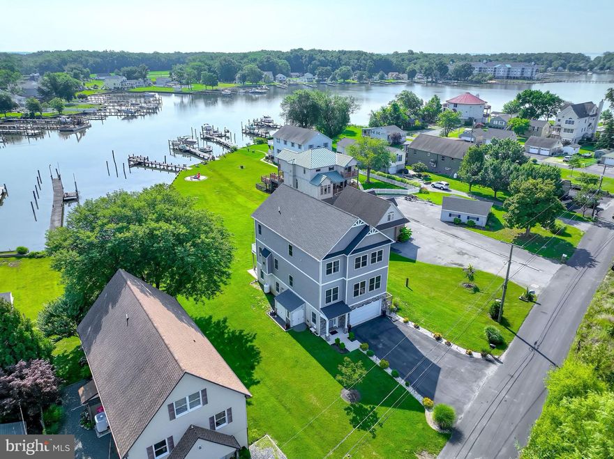 Welcome to 1110 Burke Rd, a stunning custom-built luxury waterfront house located in Middle River, MD 21220. This exquisite property offers an unparalleled living experience with its impressive features and picturesque water views. As you step inside, you'll immediately notice the open floor plan that seamlessly connects the various living spaces. The 3,280 square feet of living area provides ample room for relaxation and entertainment. The gleaming hardwood floors throughout add a touch of elegance and warmth to every corner of this beautiful home. The gourmet kitchen is a chef's dream, equipped with top-of-the-line appliances, stylish cabinetry, and ample counter space. Whether you're hosting a dinner party or enjoying a casual meal with loved ones, this kitchen will exceed your expectations. Indulge in the spa-like bathrooms that offer a tranquil retreat after a long day. The attention to detail and luxurious finishes create an atmosphere of serenity and relaxation. One of the most captivating aspects of this property is its breathtaking water views. Imagine waking up each morning to the sight of glistening waters right outside your window or savoring peaceful evenings on your private deck overlooking the serene surroundings. Situated on a generous double lot spanning over 28,885 square feet, this home provides plenty of outdoor space for recreation and enjoyment. Whether it's gardening, playing with pets, or simply basking in the natural beauty around you, this property offers endless possibilities. Middle River, MD itself boasts an array of amenities that cater to various interests. Enjoy leisurely walks along nearby trails or spend weekends exploring the local parks and recreational areas. The community also offers convenient access to shopping centers, dining options, and entertainment venues. With its exceptional features and idyllic location in Middle River, MD, 1110 Burke Rd presents an incredible opportunity for those seeking luxury waterfront living. Don't miss out on making this entertainers' dream home yours today!