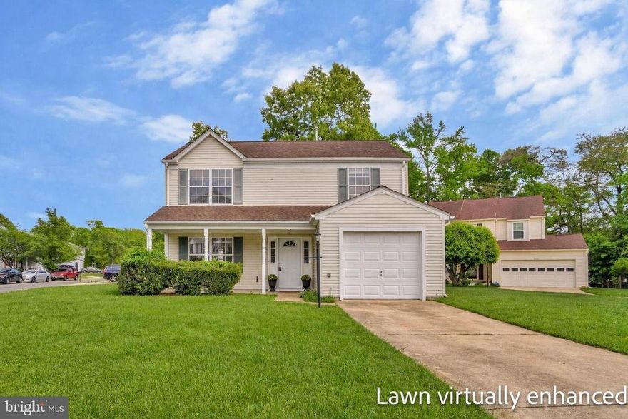 Welcome home to this charming two-story COLONIAL, perfectly situated on a desirable CORNER LOT,  with a welcoming FRONT PORCH, ideal for morning coffee or evening relaxation.  The functional, thoughtfully designed floor plan begins with an inviting entryway featuring HARDWOOD FLOORS that flow seamlessly into the kitchen and spacious family room beyond. The interior was repainted in 2024 in an on-trend neutral color palette, enhancing the home’s bright and updated feel throughout. ✨The formal living and dining rooms offer BRAND NEW CARPETING and CROWN MOLDING, creating elegant yet practical spaces for everyday living and entertaining. ✨The kitchen is equipped with STAINLESS STEEL APPLIANCES, freshly painted cabinets, and a peninsula open to the SUNNY BREAKFAST AREA and COZY FAMILY ROOM—perfect for modern lifestyles.  A sliding glass door leads to a LARGE PATIO and LEVEL BACKYARD, ideal for outdoor entertaining, barbeques, or simply enjoying the outdoors.✨ The main level also features a convenient HALF BATH, laundry/utility room, and direct access to the ATTACHED GARAGE.✨ Upstairs, the NEW CARPETING continues throughout. The SPACIOUS PRIMARY SUITE has a WALK-IN CLOSET and an ENSUITE BATH, featuring a large vanity and soaking tub/shower combination.✨ The TWO ADDITIONAL  BEDROOMS are both SURPRISINGLY LARGE, offering ample closet space and sharing the  hall bath with its extra long vanity! ✨ Located in the highly sought-after DORCHESTER community, residents enjoy amenities including a POOL, community center, tennis courts, playground, and a SCENIC LAKE with walking trails.✨ Conveniently close to shopping, dining, and major commuter routes, including ANDREWS AIR FORCE BASE, this home offers the perfect blend of comfort, convenience, and community living. Schedule your private tour today before this one gets away!! * Some photos have been virtually staged, including some virtual lawn enhancements.