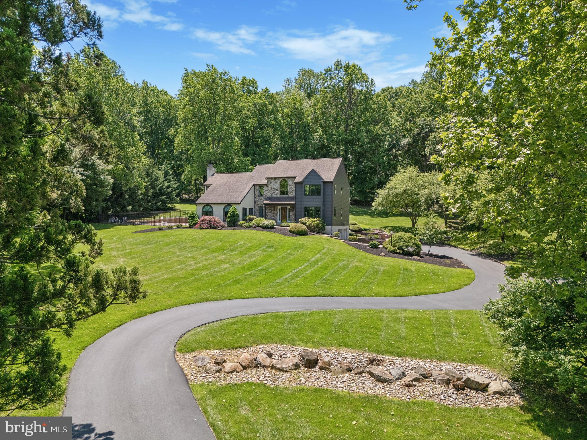 Exceptional custom home in pristine condition - nothing to do except move in! This property offers VERY LOW real estate taxes for an executive home of this caliber! Bennetts Lane is a private lane offering privacy and security. This home has been continuously maintained and updated, featuring very good quality renovations, including a gourmet kitchen (2010) with ample maple cabinetry, granite counters, a full lineup of Kitchen-Aid stainless appliances including an electric induction cooktop with Miele downdraft, a double convection wall oven, and a breakfast area overlooking the rear in-ground heated pool and covered Trex deck. The front door opens to a spacious entry foyer with porcelain tile floor, the formal living room, full dining room, the custom kitchen, powder room, laundry room, and a spacious "great room" with stone fireplace and Palladian window. Upstairs there are four bedrooms and 2 baths. The primary bedroom suite features a new custom bathroom featuring an oversized glass enclosed walk-in shower, double bowl sink, walk-in wardrobe closet, dual heating fans, an access to a small rear Juliette balcony / deck. The basement is finished with a game / 2nd family room with wet bar & True frig & icemaker, HVAC area with Lennox hybrid system (2014), a whole-house dehumidifier, a former wine cellar area, and access to the oversized 2-car side entry garage. The list of updates goes on & on: new insulated French doors (2025) in the kitchen and family room (Anderson with interior shades); new windows throughout the house (2023) with new 2" wood blinds; in-ground Anthony heated pool with Jacuzzie that was recoated with new coping and tiles in 2015, new pool equipment within the past 2 years; replaced all Hardieboard siding (2018); new well pump & tank (2023), a separate yard shed for lawn equipment, etc. etc.