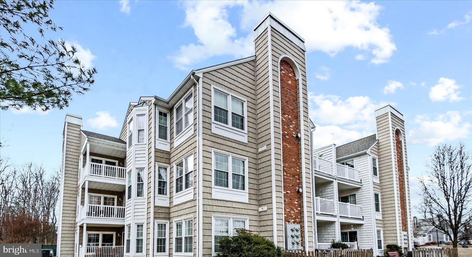 Rarely available 3rd floor condo in Summerlake, the 55+ active community. Driving into property, you can't help notice all the mature trees. Only 4 homes per floor so you maintain your privacy and it's easily accessible by elevator. When you step into this home, you will see many windows and lots of light. The living room has a fireplace making it a cozy area to watch TV or read a book. There is a designated dining area that leads to a spacious balcony with a lovely view of tress, water and the community. The primary bedroom is spacious and has an ensuite. Residents of Summerlake enjoy a gated entry with an attendant on sight M-F. There is a heated outdoor pool, hot tub, tennis & pickle ball court and clubhouse. The clubhouse has a a large party area with full size kitchen, library and more. There is an on site manager and many resident events and social activities. HOA includes Gas, Trash, & Water. Resident pays electric, heat pump owned by individual. The community also has a beautiful gazebo that in center of the lake. Don't miss this opportunity to live in Summerlake, the highly sought after 55+ community. Great location for shopping, restaurants, library, 7-11, & CVS.