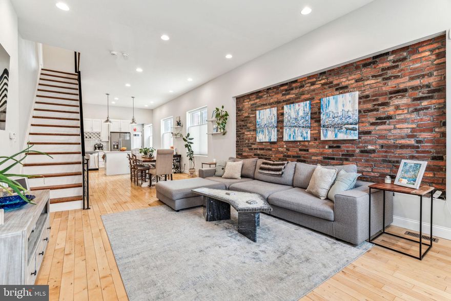 Private garage PARKING is not the only special feature of this 3 bed, 1.5 bath corner row home...

Enter from the front into an extra spacious living area with 10.5 foot ceilings, exposed brick and lots of natural light from the large front picture window. The living space flows into the light and bright dining area with more windows and hardwood floors throughout the home. Home chefs will enjoy the modern kitchen with ample stone counter space, gas range, stainless steel appliances and an island for entertaining. The private powder room is conveniently tucked behind the kitchen and next to the pantry in the mudroom entrance that leads to the garage complete with a 220V plug to charge your electric vehicle.

Upstairs are 2 good sized bedrooms and a smaller middle bedroom, hall bath and laundry. The oversized primary bedroom easily fits a king bed and has 2 closets. The rear bedroom has glass sliding doors leading out to the deck which was upgraded to trex in 2023. The hall bath is modern and spacious with a double vanity and plenty of light. Finally, the large finished basement completes the home with a private gym, home office plus extra storage/utility room.

Enjoy the convenience of urban walkability AND the luxury of private parking. Located a few blocks from American Sardine Bar, Two Eagles Cafe and walking distance to 2 grocery stores, Rittenhouse Sq, East Passyunk restaurant row and more. Schedule your appointment now to tour this one of a kind property for yourself!

Note: Previous offer terminated due to garage fit (car too long); 
Garage interior dimensions: 191.5” length x 113.5” width, and 90" width of entry door