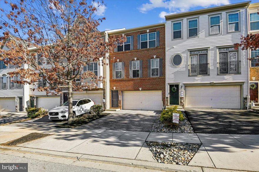 Now $600K! Beautiful brick-front townhome offering over 2,300 sq ft, three finished levels, and a 2-car garage in the sought-after Canterbury Village community in Arnold. This spacious 4-bedroom, 4-bath home stands out for its size, updates, and exceptional value in the highly desirable Broadneck area, just minutes from Annapolis.

Inside, this beautifully maintained three-level home features a bright, open layout with modern updates and comfortable living spaces designed for both everyday living and entertaining.

The sun-filled main level features a spacious living room and a welcoming family room with a cozy gas fireplace just off the kitchen. The dining area is enhanced with elegant wainscoting and chair rail molding, adding classic architectural detail and character. Custom California shutters provide both style and privacy, while new hardwood flooring installed in January 2025 adds warmth and sophistication throughout the main level.

The kitchen features granite countertops, stainless steel appliances, a five-burner gas stove, and generous cabinet and counter space. A sliding glass door leads to the newly stained deck, creating the perfect space for outdoor dining or relaxing while overlooking the fully fenced backyard.

Upstairs, you will find three bedrooms and convenient upper-level laundry. The spacious owner’s suite features tray ceilings with crown molding, a large walk-in closet, and a private bath with double-sink vanity, separate shower, and soaking tub. The upper level also includes a full hall bath and new luxury vinyl plank flooring installed throughout in 2025.

The finished lower level offers additional living flexibility with new carpet, a fourth bedroom, and a half bath. A stylish barn door adds privacy, making the space ideal for a guest room, home office, or recreation area. Sliding glass doors open to a paver patio and fenced backyard.

Located just minutes from downtown Annapolis, the United States Naval Academy, waterfront parks, shopping, dining, and major commuter routes, this home offers the perfect balance of space, location, and lifestyle in the Broadneck area.