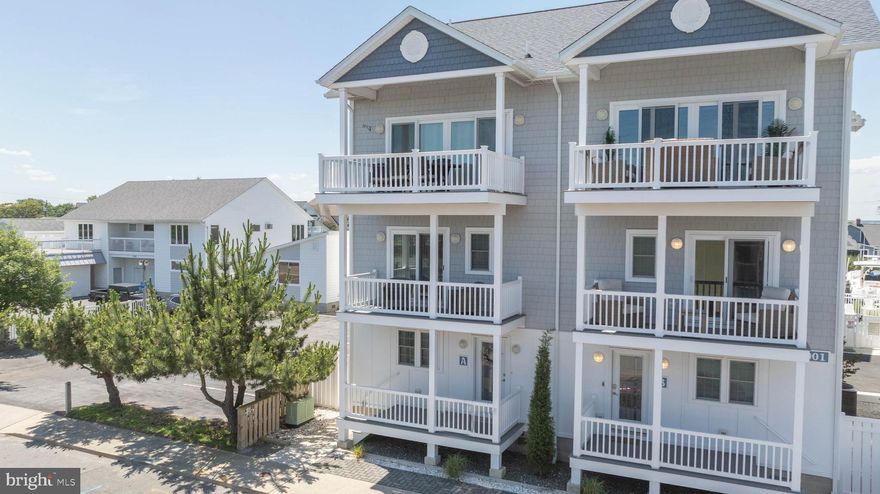 Experience the best of Ocean City living in this elegant 4-bedroom, 3.5-bath home located in a premier waterfront community just steps from Fish Tales and moments from the beach, boardwalk, Jolly Roger Amusement Park, and some of the area's most popular waterfront restaurants and attractions. Built in 2022, this impeccably maintained residence blends high-end finishes with an unbeatable location. Inside, you’ll find thoughtfully curated design with no carpet—only engineered hardwood, luxury vinyl plank, and tile for a sleek and sophisticated feel throughout. The open-concept main level features a designer kitchen with quartz countertops, custom cabinetry, and an oversized island that anchors the space for effortless entertaining. Multiple outdoor living areas—including a private deck off the primary suite—offer the perfect setting for relaxing after a day on the water. The home also includes a deeded boat slip with a 10,000 lb lift, electric, and water, making it easy to enjoy boating and bay life just steps from your front door. The oversized 18-foot wide garage provides generous storage and convenience, while the community’s heated pool adds a resort-like touch to your everyday. Whether you're seeking a refined second home, investment opportunity, or year-round residence, this property delivers exceptional comfort, style, and access to all that Ocean City has to offer.