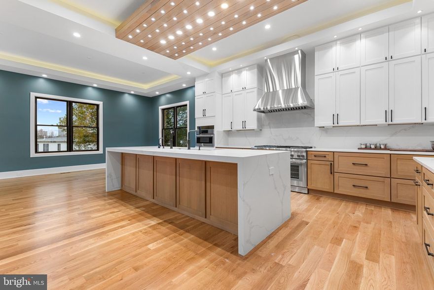 Seize the opportunity to personalize this exquisite custom modern-transitional home in sought-after Pimmit Hills. Currently under construction, this expansive residence offers nearly 8,000 sq ft of refined living space, featuring 7 bedrooms, 7 full baths, 2 half baths, and a 3-car garage, all with convenient access to shopping, dining, and major commuter routes. The main level showcases an open layout with 11’ ceilings with , including  formal living and dining areas, a guest suite, and a chef’s kitchen equipped with top-of-the-line Thermador appliances (60” sink and refrigerator, double dishwashers, gas range, and oven/microwave combo), quartz or granite countertops, and custom cabinetry. The kitchen flows seamlessly into a bright morning room and a spacious family room with a fireplace, opening to a deck, perfect for indoor-outdoor living. A butler’s pantry with a wine cooler enhances the space for entertaining. Upstairs, the luxurious primary suite offers a spa-like bath and expansive walk-in closets, complemented by three additional en-suite bedrooms, a loft/family area, laundry room, and a private balcony. The lower level is an entertainer’s dream, featuring a large recreation room with a wet bar, media room, two en-suite bedrooms, and a walkout to a flagstone patio. Additional unexcavated space provides flexibility for future customization. Don’t miss the chance to make this home your own. Estimated completion: Winter 2026.