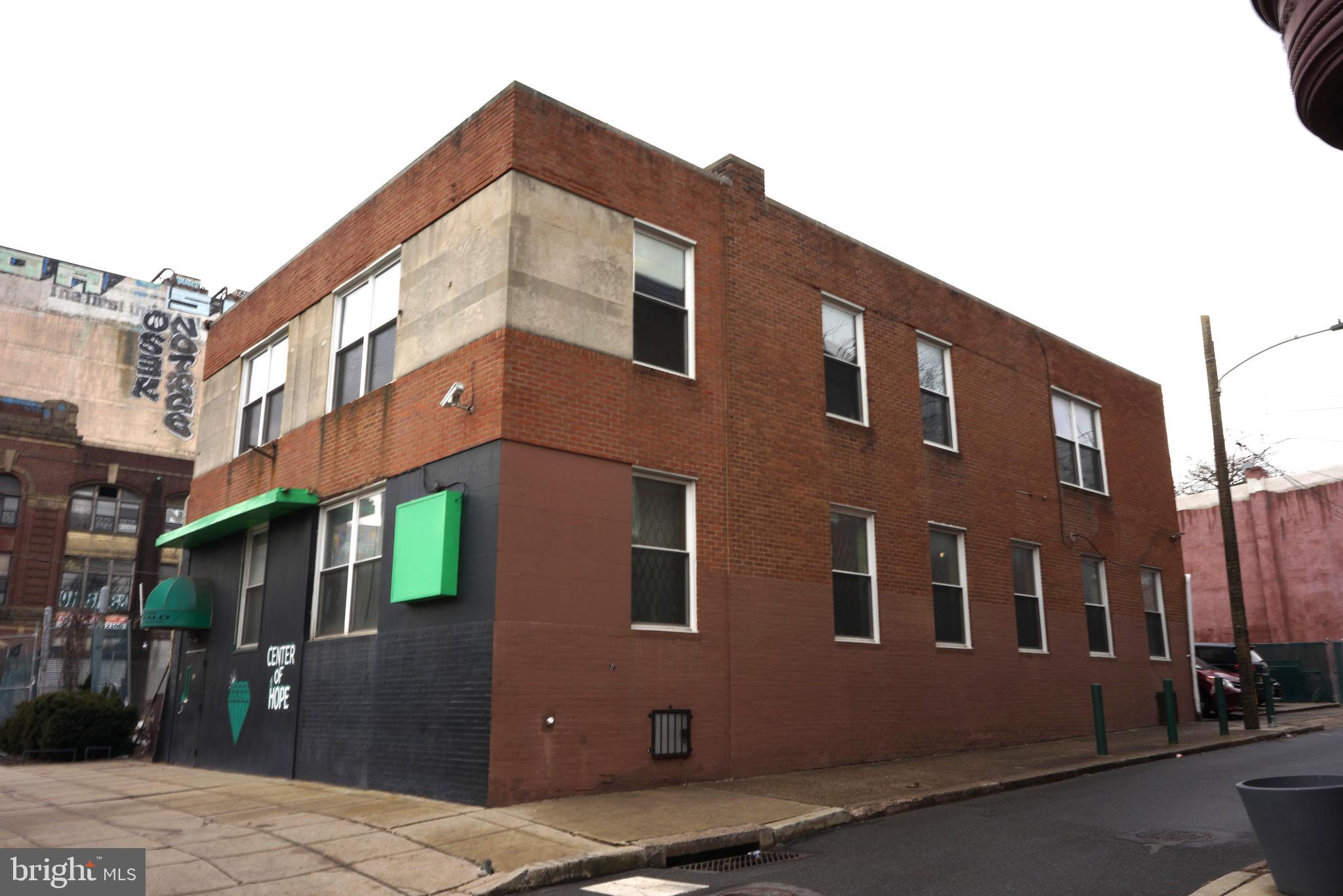 Presenting a 2-story freestanding CMX3 Commercial Mixed-Use building, with a combined footage of 8036 SF, including a partially finished basement. The sale offer is accompanied by an adjacent lot, offering a combined land area of 4,544 SF. The property features a 37' frontage on Broad Street, is strategically positioned between Temple University's main campus and its medical school, with convenient walking access to over 11 public transportation routes.
Property Details:
Building Size: 4,736 SF across the first and second floor and 3,300 SF in partially improved basement. Two staircases provide easy access and fire escape routes from basement to the first floor. Parking: On-site parking for 4 vehicles, with a wheelchair-accessible ramp. Heating: Electric baseboard heating, oil boiler, radiators, and some existing ductwork for future zoned HVAC systems. Cooling: Window A/C units. Security: Equipped with cameras and fire alarm system. Historical Uses: Formerly utilized as a workers' union headquarter, Western Union offices, detective/security/alarm agencies and adult day care services.
Investment Highlights:
Located in Opportunity Zone: Eligible for some capital gain tax benefits. Since vacant for more than 3 years, additional benefits of significant improvement exemption may apply. Potential Expansion: Originally a 3-story structure, so there is the possibility of rebuilding the third story. Bulk Sale Offering: This sale is for a package deal only, comprising of two parcels of real estate, which cannot be purchased separately. The properties included in this offering are as follows: Property 1: 2810 N Broad Street, Philadelphia, PA 19132 (Tax ID: 883361895); Property 2: Fenced vacant lot located at 1412 W Rush Street, Philadelphia, PA 19132 (Tax ID: 111014200). Located in Avenue of the Art North cultural district.
