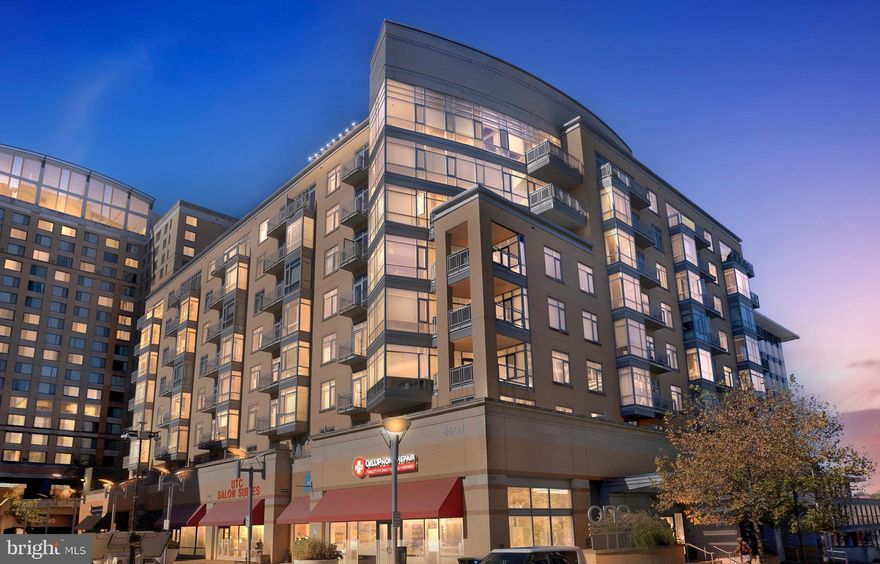 Welcome home to this breathtaking corner unit on the seventh floor of the ONE INDEPENDENCE PLAZA, with beautiful views of the skyline. Bright and airy, with close to nine foot ceilings, and floor to ceiling windows, you will enjoy modern living in the heart of University Town Center. The unit itself offers an open floor concept with modern amenities and many updates. The well appointed kitchen with stainless steel appliances, cherry cabinets, granite counter tops is in the heart of the unit, overlooking the living room, connected dining area, and large balcony. Brand new updates include a stainless steel built-in microwave, faucet, and garbage disposal. The nook adjacent to the dining area can function as a bar area, pantry with shelving, office/computer desk area, and more. Dark cherry hardwood floors flow through the living room, dining area and hallway. The spacious primary bedroom has brand new carpet and paint, and offers a walk in closet. The en suite primary bathroom features a soaking tub, vanity with double sinks, granite top, brand new faucets and brand new vanity light. The second bedroom has two large closets. The second full, hallway bathroom has a large shower, vanity with granite counter top, and brand new vanity light. All lighting has just been updated with modern fixtures, to include the pendent lighting over the bar top. The HVAC system was replaced in 2016 and just serviced for the upcoming season. A comprehensive home warranty conveys to the new owner for one full year after settlement. The building is secure and the unit comes with its own assigned parking spot in the adjacent Garage B. Access to parking is from outside as well as inside the building.  On the second floor of the building, owners have access to a gym, private terrace, and community room equipped with kitchen, billiard area, and TV lounge. Right across from the building entrance is the  Regal Hyattsville Royals movie theatre and several restaurants. Starbucks and Safeway are a seven minute walk away. Hyattsville Crossing metro station and LA fitness are withing a 12 minute walk. The Mall at Prince George’s county is right behind the building.  University of Maryland is a 5 minute drive away. All that remains is to move in right in time to enjoy the holiday season in your new home. PLEASE CHECK OUT THE VIDEO TOUR FOR A 3D WALKTHROUGH OF THE UNIT!