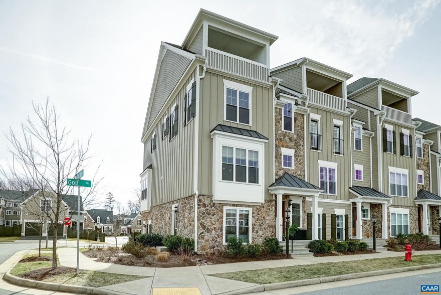 Traditional style meets modern elegance in this beautifully refreshed luxury townhome in the heart of Old Trail in Crozet, VA. Walk to Old Trail Village shops, dining, golf and trails while enjoying stunning mountain views and low-maintenance living. Hardwoods flow throughout the home, complemented by a fully renovated gourmet kitchen featuring a large quartz island, white cabinetry, new GE Caf� stainless appliances with bronze accents, and an oversized walk-in pantry with prep sink and wine cooler. The main level offers a light-filled dining room and living room with new gas fireplace, ideal for entertaining, plus a composite covered deck with gas line for grilling. Upstairs, the spacious owner?s suite includes a refreshed, spa-like bath with double vanity, large walk-in shower and two closets. A guest suite with ensuite bath and office nook, plus an upgraded laundry room with utility sink, add convenience. The top level offers flexible space for media, fitness or guests and opens to a covered rooftop terrace with mountain views. Lower level features a private-entry bedroom and bath?ideal for in-laws or short-term rental. Oversized 2-car garage completes this exceptional Old Trail home.,Quartz Counter,White Cabinets