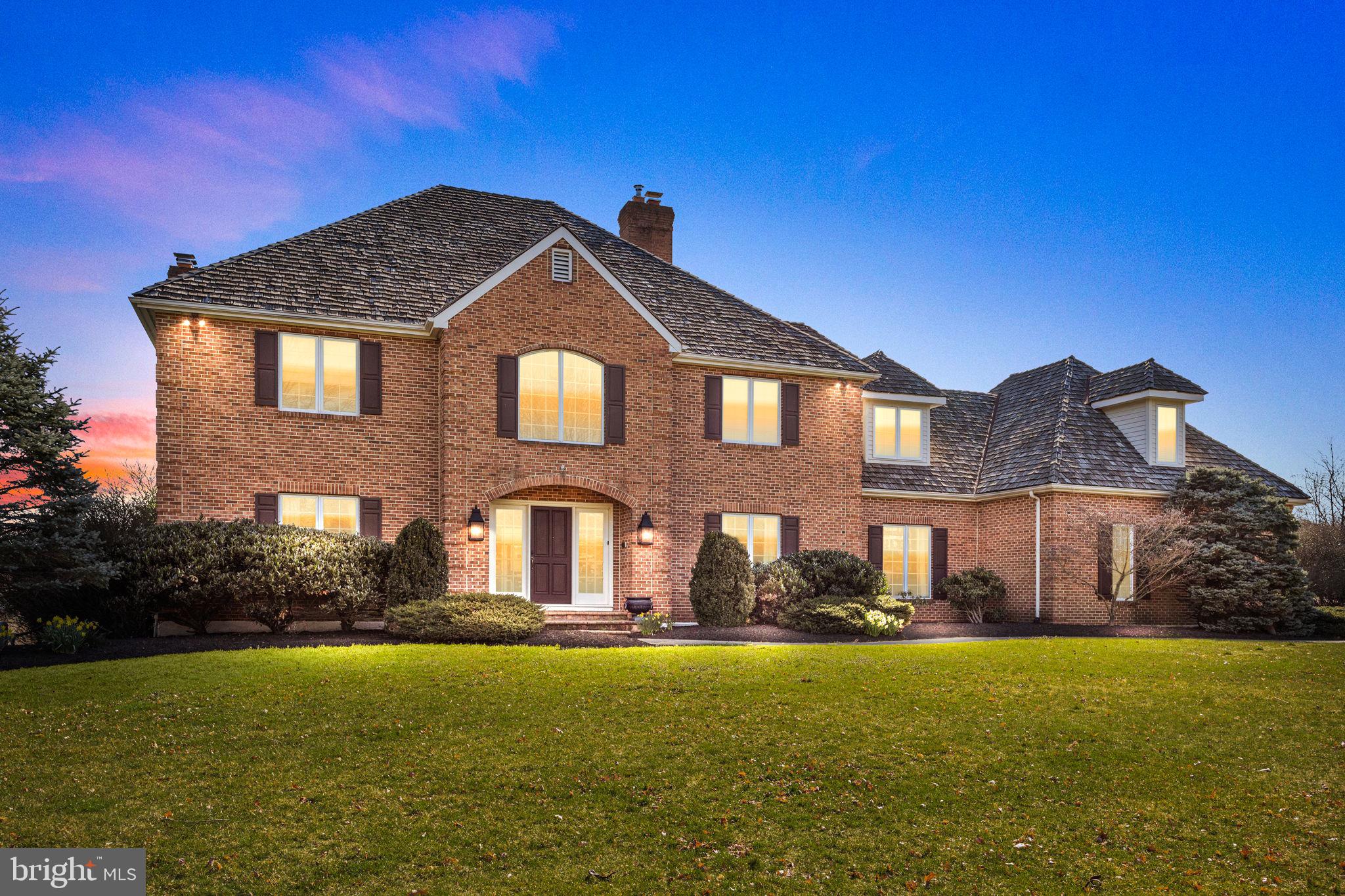 Welcome to 5 Avondale Drive! This immaculate 5000+sq.ft brick colonial home is located on 2.3 gorgeous acres overlooking the neighborhood ponds and Jericho Mountain in sought after Sycamore Farm. One of the nicest lots in Upper Makefield. Quiet cul-de-sac perfect for an evening stroll in the Sycamore Farm Community. Great curb appeal as you walk up to the covered front entry. Enter into a large open foyer with an abundance of natural light pouring into the home with all the windows. To your left is a huge home office space that has a spectacular coffered ceiling and built-ins. Outside, a whole house generator for peace of mind. To the right of the front foyer is a formal living room with a cozy fireplace. Separate dining room that flows perfectly from the kitchen for entertaining. Open floor plan from the Family Room, Breakfast area and kitchen with stainless steel appliances, island seating, tile backsplash and lots of counter space. Breakfast/sitting area surrounded by windows and multiple skylights. Double sliding doors leading out to the back deck with peaceful views of the large backyard. Step down from the sitting area into the Family Room that has a gorgeous stone fireplace and built-in shelving on both sides. Main-floor Mudroom/Laundry room is a dream - has its own separate entry with a covered stoop and has a 2nd staircase to access the upper level of the home between the 4th and 5th bedroom. Upper Level gives you a total of 5 bedrooms and 3 Full bathrooms, 2 of which have been gut renovated . The Master suite features a high vaulted ceiling and lit up vestibule which leads to a large walk-in closet, and fully renovated bath including a tile enclosed shower with multiple shower heads, a claw-foot tub, a skylight and double vanities. Large secondary Bedrooms, one princess suite with its own full Bath and walk in closets. Additional beautiful Hall Bath with double vanities. Walk-out basement with plenty of light and great access to a back patio and an unbelievable view. Love to Fish? The Pond is just a short walk away. Enjoy relaxed living and entertaining in the heart of Upper Makefield. Located a minutes drive to Sol Feinstone elementary and Jericho National Golf Club. Easy drive to I-95, route #1 corridor, Princeton and NJ train transit. Close proximity to Newtown, New Hope,Yardley and Doylestown.