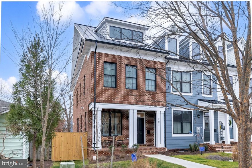 If you missed your opportunity to purchase in this neighborhood last year, here is your chance to make up for it! Be prepared to be stunned by Darden Towns as it's an essentially brand-new luxury townhome neighborhood in the heart of Del Ray that was just built last year. This beautiful brick end-unit townhome is only steps away from shops, restaurants, bars, parks, etc and unlike other new construction, the builder spared no expense by only using high-end finishes with longevity, a modern yet functional design and layout in mind. This is evident by the flooring choices, the quartz countertops, the tiled kitchen backsplash, the black Pella windows, the sleek fireplace, and the full wet bar. This home has 4 levels - The main level features an open floor plan throughout with a dining room, living room, spacious kitchen, powder room, and direct access to the private backyard. The kitchen has a huge eat-at island with stainless steel Bosch appliances and no shortage of natural light while the shaker cabinets, tiled backsplash, and quartz countertops complement the modern feel. The first upper level has a total of 3 bedrooms and 2 full bathrooms including the spacious primary bedroom with vaulted ceilings, a large walk-in closet, and the primary bathroom with double sinks, a walk-in shower with glass doors, and a gorgeous soaking tub. The two other sizeable bedrooms on this level share access to another full bathroom which is a Jack and Jill set up also with high-end finishes. The separate laundry area is also conveniently located just down the hall. On the top floor is where you'll find a large partially covered rooftop terrace, TV sitting area, outdoor wet bar, and great views of the Masonic Temple! This level also has another bedroom that could easily be used as a home office along with another half-bath. The basement level offers a large entertainment room and wet bar making it a perfect area for entertaining, along with a 5th  bedroom and full - bath. The exterior is built with Hardie plank siding and has a modern yet traditional feel. Each of the 4 homes in this quaint neighborhood has its own 2 designated parking spaces, a landscaped front yard, a fenced backyard with a flagstone or paver patio, and a grassy area for pets. Don't miss your second chance to acquire all of these sought-after qualities while being just steps away from the great shops, restaurants, and events of Mt. Vernon Ave and less than half a mile from Braddock Rd. Metro.