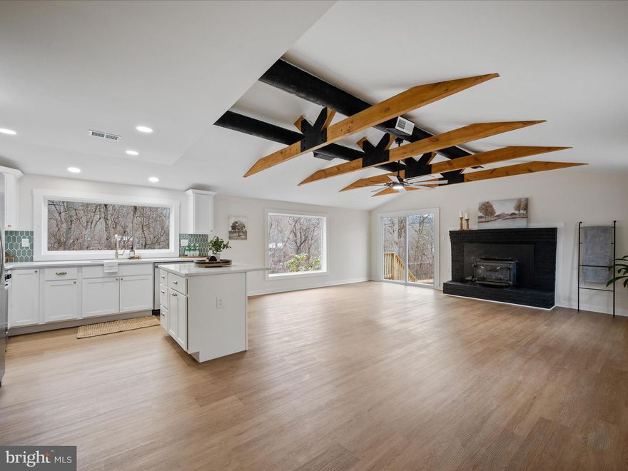 Stunning Fully Renovated Home with Modern Upgrades & Private Setting

Nestled in the peaceful woods of Harpers Ferry, this architecturally distinct home is a true retreat. From the moment you step inside, the vaulted living room ceiling with exposed timber beams, industrial-modern ducting, and a stylish ceiling fan create an unforgettable first impression. 

The living area seamlessly flows into the elegantly designed kitchen, featuring soft-close cabinetry, granite countertops, and a signature tile backsplash. Thoughtfully designed for a chef, the kitchen boasts a spacious island with breakfast bar seating, stainless steel appliances, and abundant natural light.

Both bedrooms offer the luxury of private baths. The primary suite showcases an ensuite bath with a custom tile walk-in shower, while the hall bath includes a shower/tub combo with tile surround. Throughout the home, durable luxury vinyl plank flooring ensures low-maintenance living without sacrificing style.

Set on a serene, private lot, this home offers the perfect balance of tranquility and convenience—just 10 minutes from Loudoun County.

Recent Renovation Includes: New HVAC, New Roof, New Water Heater, New Well Pump, New Pressure Tank, and New Appliances!

Come experience this beautifully updated home and make it yours today!