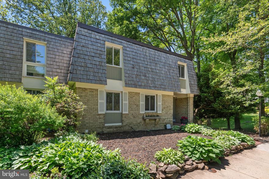 Welcome to this stunningly renovated, expansive end unit townhome with a lower-level multigenerational suite with an independent entrance. Where serenity meets sophisticated and modern design. Tucked away on a lush, wooded lot, this move-in-ready home has been meticulously updated to offer a rare combination of luxury, comfort, and incredible functional flexibility. The heart of the home is a gourmet chef’s kitchen that blends bold style with high-end utility. Renovated with a sleek two-toned cabinetry design it features a striking black hexagonal tile backsplash, new premium stainless-steel appliances, and elegant marble-style flooring. Large pantry, and an abundance of counter top and storage space. Sun filled dining room off the kitchen makes entertaining a joy, plenty of room for a generous dining table for everyday use or large holiday gatherings. The open-concept living areas are anchored by beautiful brand-new hardwood-style flooring and framed by expansive windows that act as living artwork. Massive sliding glass doors lead to a grand entertainment deck, offering a private perch overlooking a canopy of mature trees—the perfect backdrop for morning coffee or sunset gatherings. The upper-level bedrooms serve as peaceful retreats, featuring cherry-toned wood flooring, modern ceiling fans, and generous walk-in closets with custom built-in organization. Every bathroom has been transformed into a spa-like oasis, showcasing designer floor-to-ceiling tile work, updated vanities with new countertops, and contemporary brushed nickel fixtures. The fully finished walk-out lower level is a true standout, offering a complete second living environment with an independent entrance ideal for an In-Law Suite, guest apartment, or long-term rental opportunity. This self-contained space is a bedroom with a full bath, as well as a kitchenette. The other side is a spacious family room with plush carpeting ,and a separate entrance through the private sliding doors to a covered lower patio and the tranquil rear yard. 

Experience the best of Montgomery Village living with unparalleled access to the outdoors and amenities the community has to offer, including lakes, parks, playgrounds, pickleball courts, tennis courts, and access to six community pools. Just a short stroll away, you will find the picturesque walking trails around Lake Whetstone and Lake Marion, offering scenic water views and peaceful paths. Conveniently located near the shopping and dining of Gaithersburg, and with immediate access to I-270 and the ICC, this home offers a perfect balance of seclusion and city convenience. Feel the perfect blend of modern luxury and suburban tranquility. Schedule your private tour today!