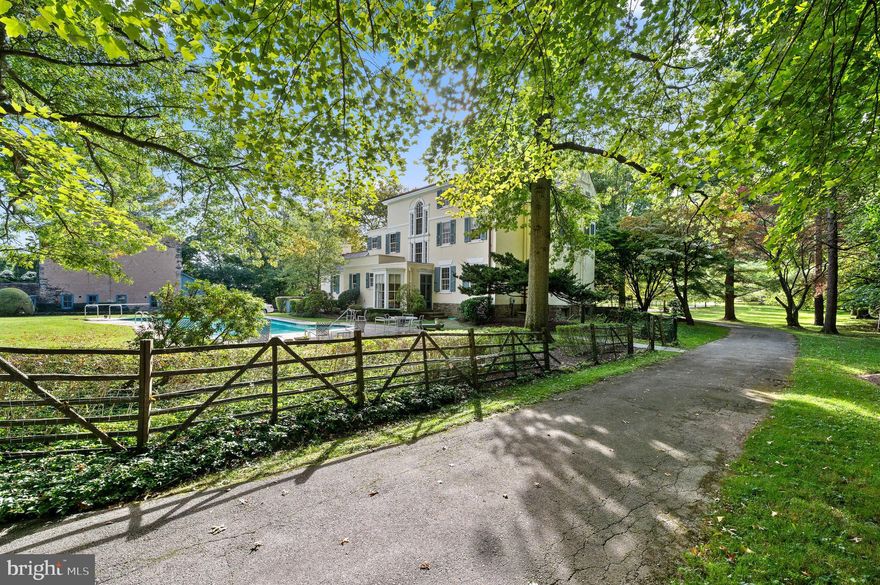 "Kimberlea" stands as a timeless masterpiece set on a sprawling 5-acre estate in Gladwyne, adjacent to the 9th hole of the Philadelphia Country Club.  Built in 1832, this iconic estate property is ready for a transformative new chapter. The expansive grounds, once dedicated to equestrian pursuits, now boast mature trees, specimen plantings, and panoramic views, creating an ambiance rich in history and potential.

The main residence, characterized by Federal style architecture, seamlessly blends old-world charm with modern possibilities. The inviting living room, complete with a fireplace and library nook, and French doors open onto a tranquil patio. The grand dining room flows into a butler's pantry and an eat-in kitchen overlooking a peaceful swimming pool. The residence has a recently updated 7/8 inch cedar shake roof.

Upstairs, the second floor reveals three spacious bedrooms with fireplaces and two baths, while the third floor offers four additional bedrooms and two baths. These spaces can easily transform into study rooms or creative spaces for crafts and gift-wrapping.

While "Kimberlea" has been lovingly maintained and doesn't require immediate restoration, it is indeed a BIG project ready to be shaped by ambitious visions. The sellers welcome offers from buyers eager to infuse their personality into this grand estate.

Imagine transforming the historical stone bank barn into a lively Party Barn, complete with indoor pickle ball, half-court basketball, and a movie/play room. The vast property has ample space for a tennis court and putting green, promising five acres of fun and leisure. The kitchen, not part of the original structure, can be expanded towards the barn, creating an open-concept family room with an attached garage. The carriage house presents opportunities for a secluded home office, private gym, or an in-law cottage.

The living room, traditionally formal, can be re-imagined to include a library and a pool table, creating a space for relaxation and entertainment. 

"Kimberlea" is a unique opportunity for those who are passionate about crafting a home tailored to their desires. Located close to award-winning schools and major transportation routes, and imbued with the esteemed ambiance of the Philadelphia Country Club, this estate is a canvas for dreams.