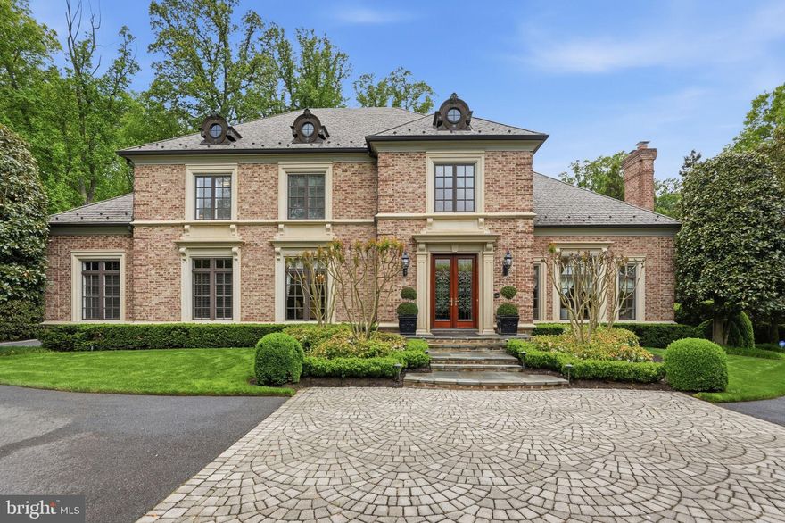 Welcome to 1204 Daviswood Drive in McLean—a truly one-of-a-kind residence that seamlessly blends timeless Tuscan inspiration with the refined, modern finishes that appeal to today’s most discerning luxury buyer. Perfectly positioned in one of Northern Virginia’s most sought-after school pyramids, this exceptional property offers an unbeatable location less than a mile from the Dulles Toll Road and moments from Tysons Corner. Nestled within an established community surrounded by mature trees and nearby parks, Daviswood Drive delivers both privacy and convenience in equal measure.

This expansive five-bedroom, six full and three half-bath estate is designed for both elegant everyday living and grand-scale entertaining. A stately circular driveway and three-car garage provide a dramatic arrival and ample space for guests. Inside, a breathtaking two-story foyer sets the tone, highlighted by a grand chandelier and sweeping circular staircase.

The main level is anchored by a formal living room featuring an oversized hearth and a custom gas-burning fireplace imported directly from Italy, complimented by floor-to-ceiling windows that flood the home with natural light. A distinguished private office showcases rich mahogany built-ins and opens directly to the rear grounds—offering a serene workspace with seamless indoor-outdoor flow.

The outdoor experience is nothing short of extraordinary. Inspired by the grandeur of Versailles, the fully reimagined rear grounds feature meticulously manicured hedges, a statement fountain, and tumbled travertine hardscaping. A custom putting green, expansive lawn, and a stunning lap pool with water features create a private resort-style oasis—perfect for entertaining or quiet retreat.

At the heart of the home, the chef’s kitchen is outfitted with exquisite Italian marble countertops, a top-tier luxury appliance package, a generous walk-in pantry, and thoughtful custom finishes throughout.
Upstairs, four spacious ensuite bedrooms provide comfort and privacy for family and guests alike. The primary suite is a true sanctuary, complete with dual, fully appointed winged bathrooms—an elevated feature designed for today’s lifestyle.

The lower level is an entertainer’s dream. Enjoy a temperature-controlled wine cellar with capacity for over 200 bottles, a sprawling recreation room and a parlor outfitted with a pool table and air hockey. A custom European-imported bar showcases intricate woodwork and craftsmanship, while the dedicated home theater—featuring bespoke artwork and integrated seating—offers the ultimate cinematic experience. An additional bedroom or gym, well appointed full bathroom and walkout access complete this level.
Throughout the home, imported Italian columns, detailed crown, picture and chair moldings  accented with impeccable trim work reflect a level of craftsmanship rarely found.

Truly unmatched in design, location, and lifestyle—this is a rare opportunity to own a statement residence in the heart of McLean.

Don’t miss this exceptional offering. Welcome Home!