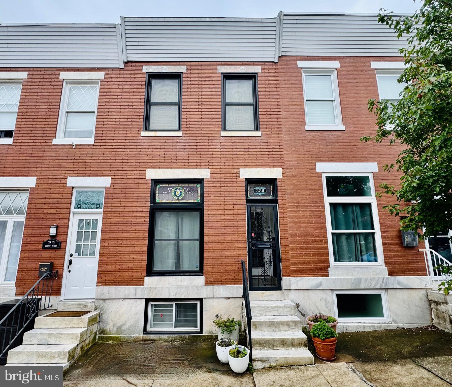 Charming Brewers Hill Townhome with Modern Amenities & Income Potential
Welcome to this beautifully updated three-level rowhome located in the heart of Baltimore City’s sought-after Brewers Hill neighborhood. Built in 1915, this classic brick home blends historic charm with thoughtful modern upgrades—offering the perfect combination of character, comfort, and versatility.
Iconic marble steps welcome you to the main level, where you’ll find soaring ceilings, rich moldings, exposed brick accents, and engineered hardwood floors that extend throughout the space. The bright and spacious kitchen is outfitted with stainless steel appliances, dual sinks, and ample cabinetry, with room to add an island if desired. A convenient powder room and direct access to the spacious private rear parking pad/ patio area, adding to the functionality of the main level.
Upstairs, the home features two generous bedrooms filled with natural light, a fully renovated luxury bathroom, exposed brick walls, and the convenience of bedroom-level laundry. The primary suite includes his and hers closets, tall ceilings, and gleaming hardwood floors—rare finds in a home of this vintage.
The fully finished lower level offers exceptional flexibility and income potential. With its own private exterior entrance and interior access to the main home, this space is ideal as an in-law suite, au pair quarters, or a short- or long-term rental. It includes a spacious bedroom, an open-concept living area, a second fully equipped kitchen with maple cabinetry, and a beautifully renovated full bath.
Major updates—such as a new roof and windows in 2024—provide peace of mind for the next owner. Located just moments from top-rated restaurants, boutique shopping, parks, and commuter routes, this home offers an unmatched urban lifestyle in one of Baltimore’s most vibrant communities.
Don’t miss your chance to own a truly special property in Brewers Hill—schedule your private tour today!