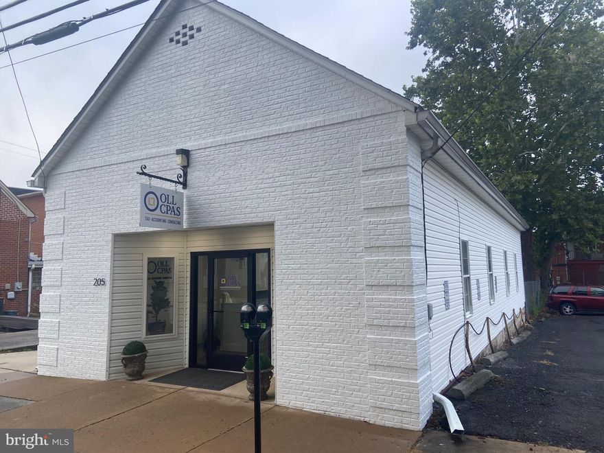 Fully renovated in 2022, this building has housed a CPA firm for the past twenty years and is well suited to a variety of uses.  New roof in 2016.  2022 renovations included: new LVP flooring throughout, new ceiling tiles and LED lighting, entire interior painted and  brick facade painted white. HVAC is forced air with propane.  Security System installed and in use.  Fully wired with CAT5. Building does not include on-parcel parking.  Four parking spaces are leased from adjacent property owner.  New owner will need to negotiate new lease.  Details of current lease are available.  On street parking is also available via permit from City of Charles Town.     Certain filing cabinets, television and refrigerator negotiable.  Seller will not sell to any CPA or tax preparation company users.
Listing agent related to seller